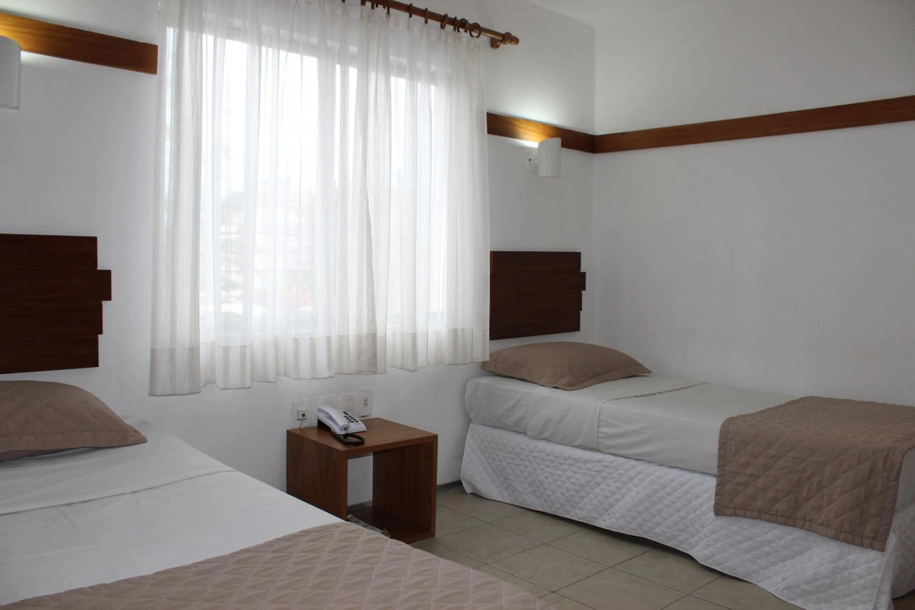 Bed in Portal Da Praia Hotel