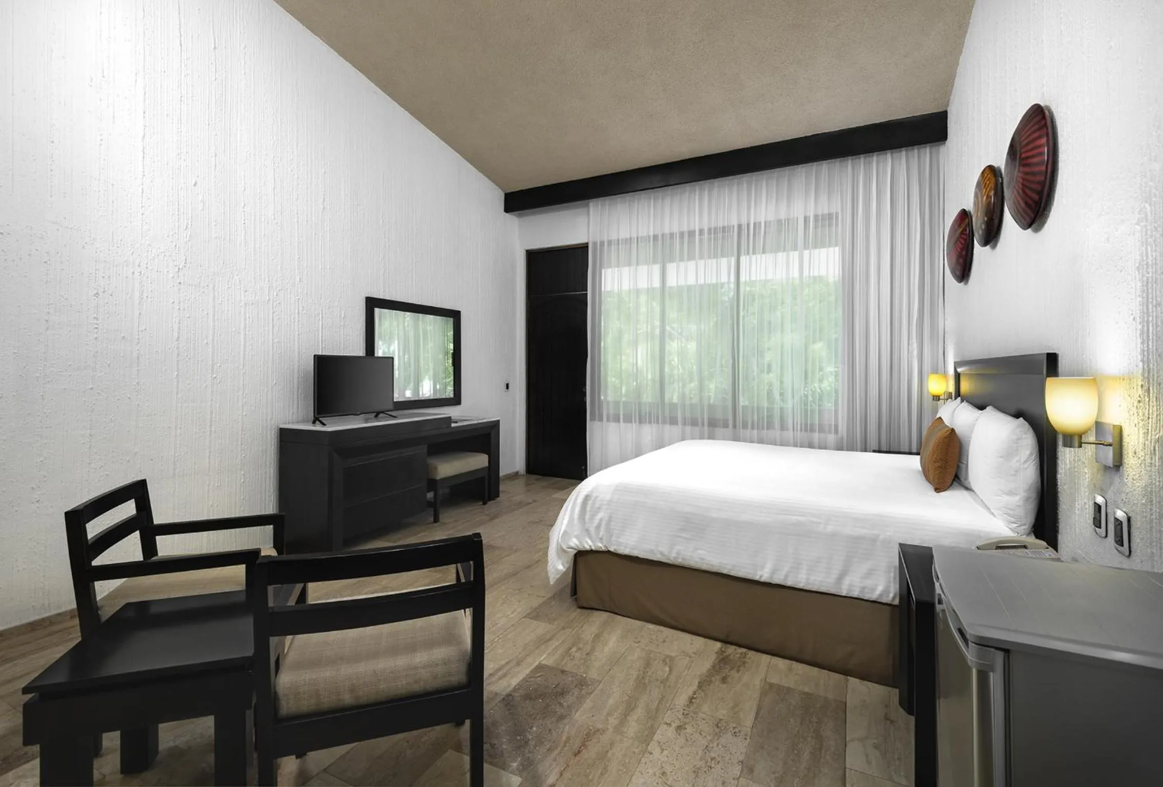 Bed in El Cid Granada Hotel & Country Club