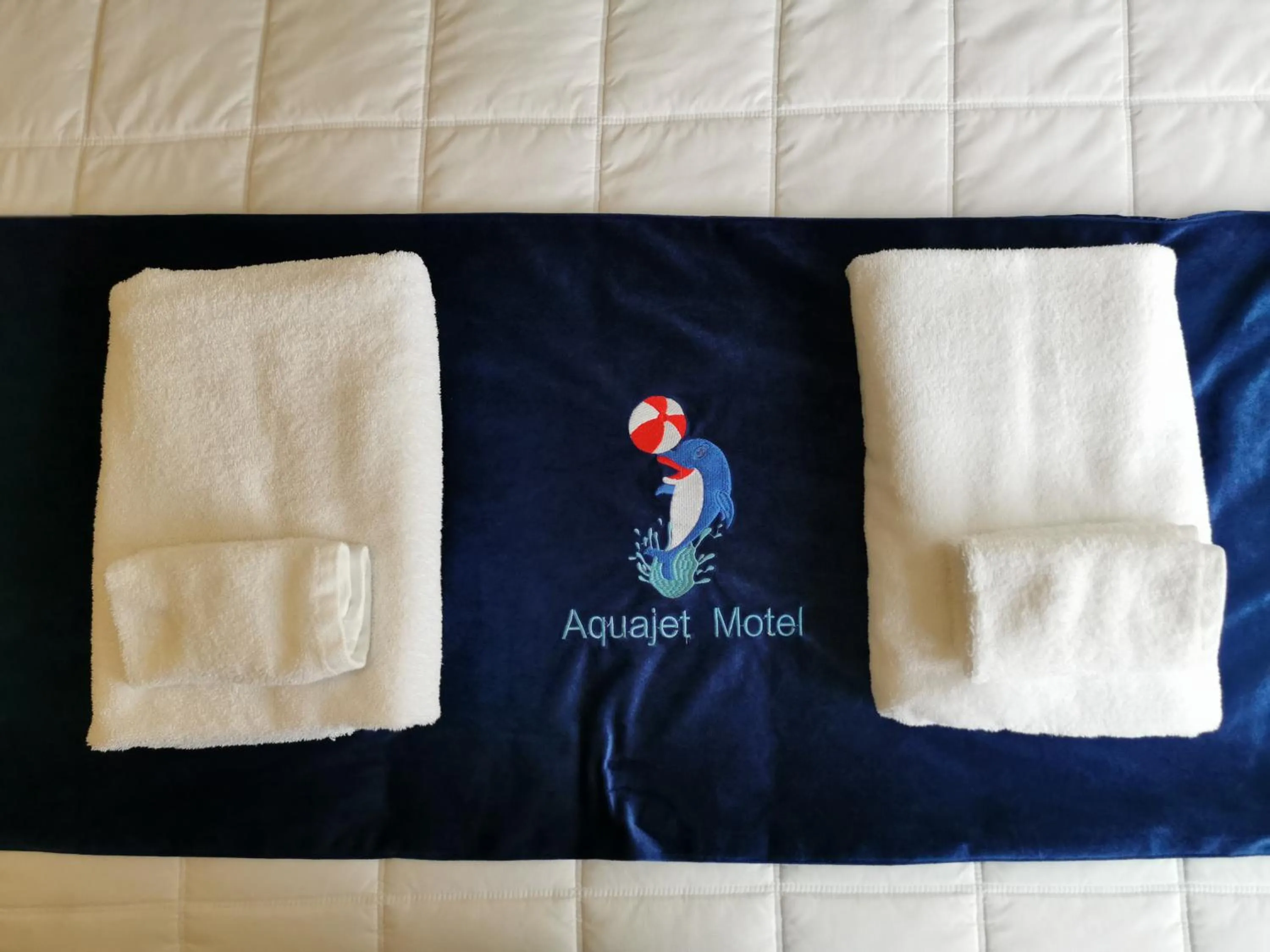 Bed in Aquajet Motel