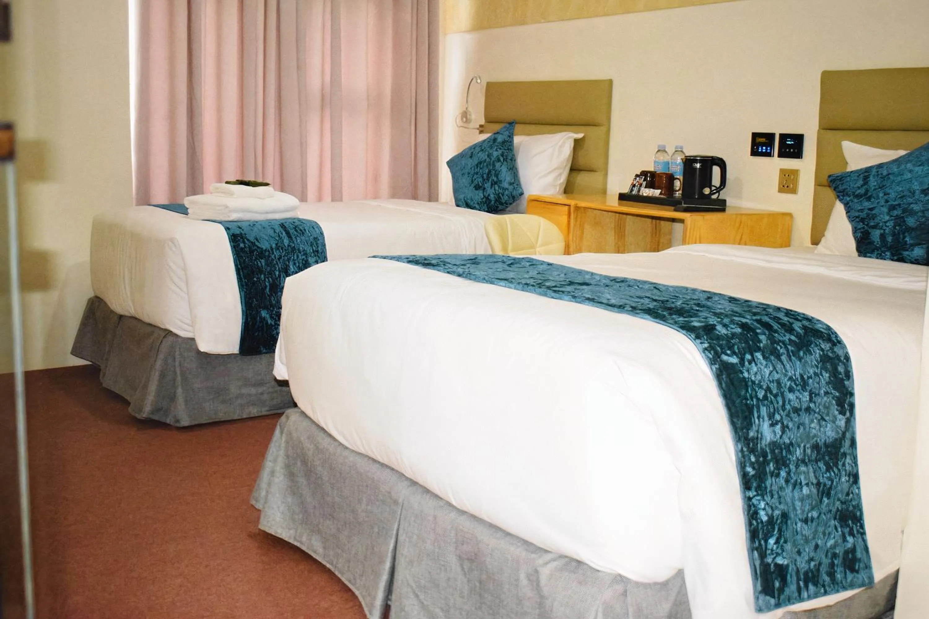 Bed in Cebu Dulcinea Hotel and Suites-MACTAN AIRPORT HOTEL