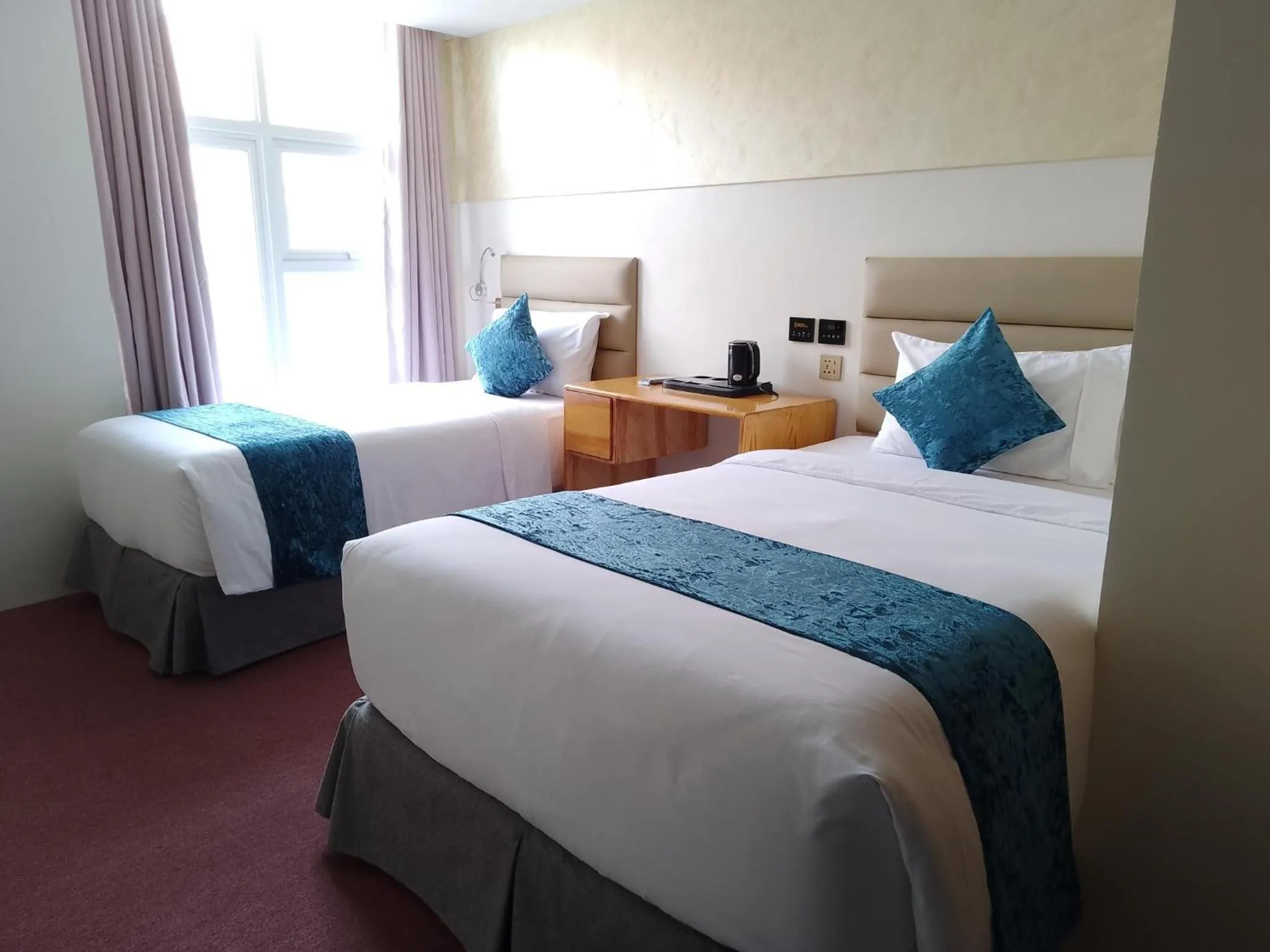 Bed in Cebu Dulcinea Hotel and Suites-MACTAN AIRPORT HOTEL