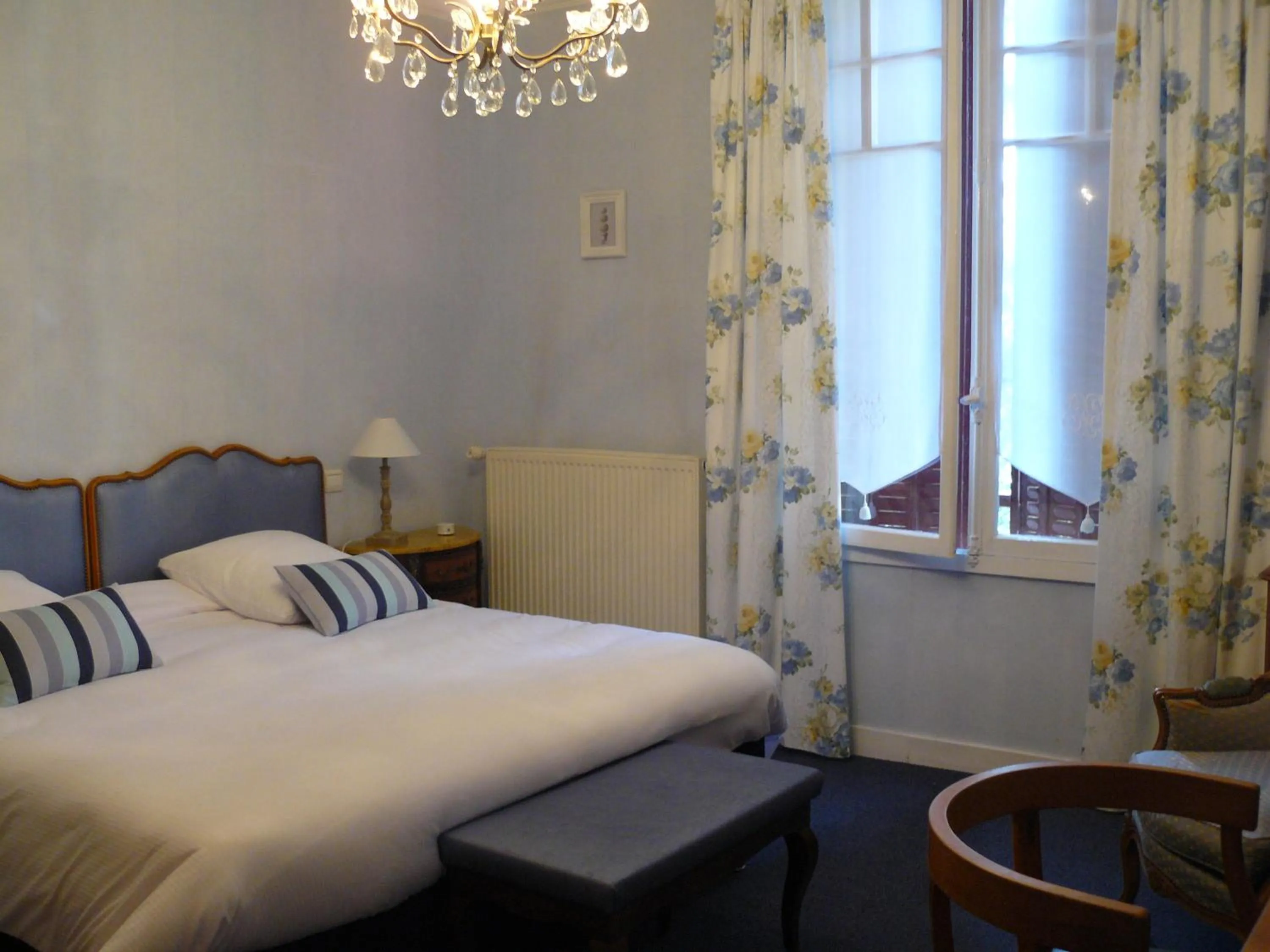 Bed in La Villa Bois Joli HOTEL RESTAURANT