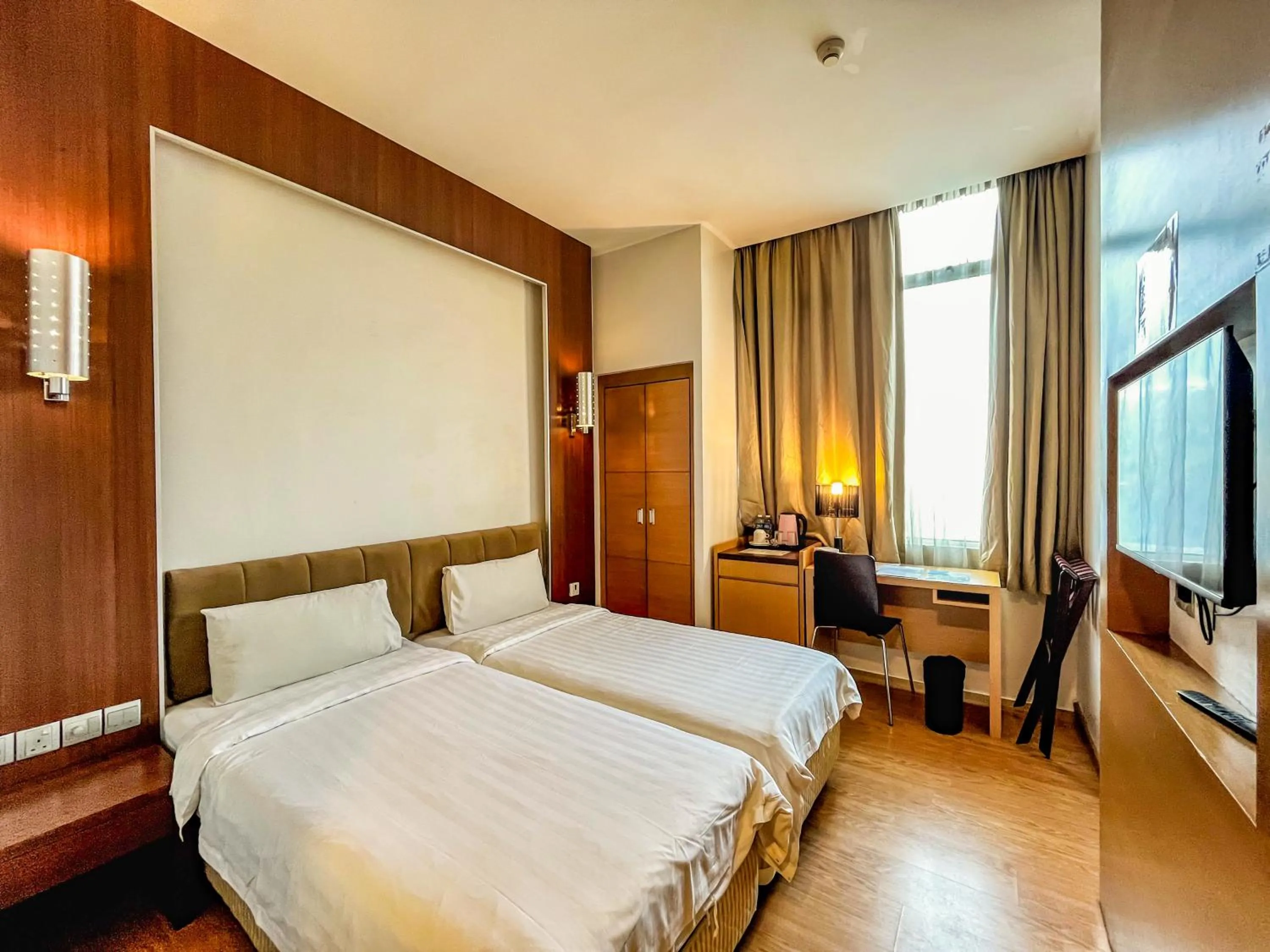 Bed in Courtyard Hotel 1Borneo