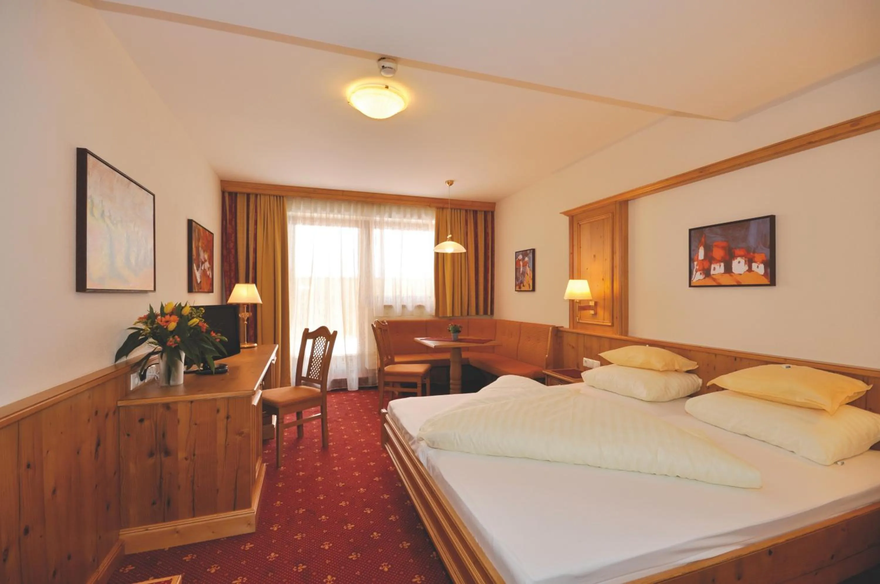 Photo of the whole room, Bed in Hotel Alphof Alpbach