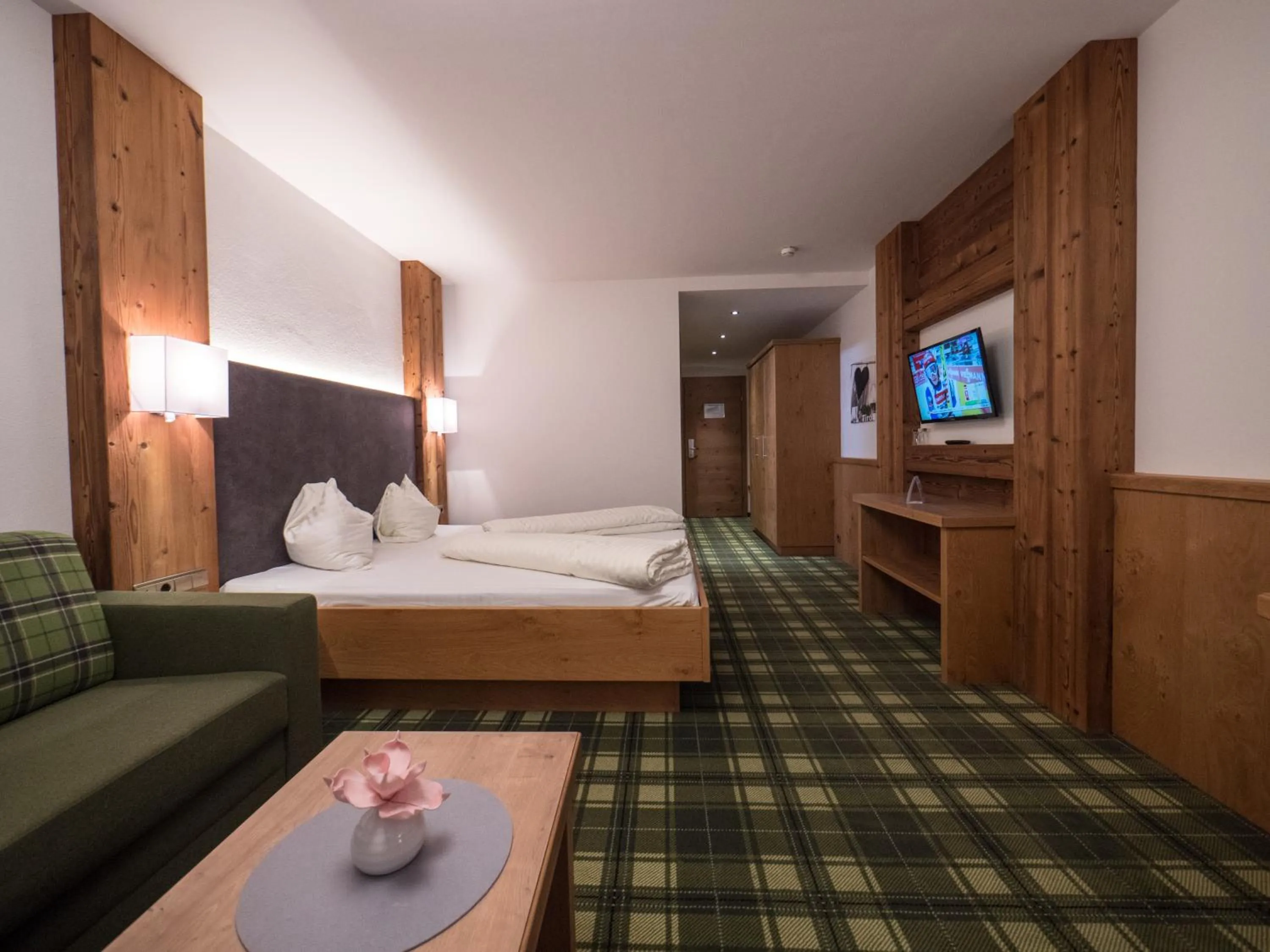 Photo of the whole room, Bed in Hotel Alphof Alpbach