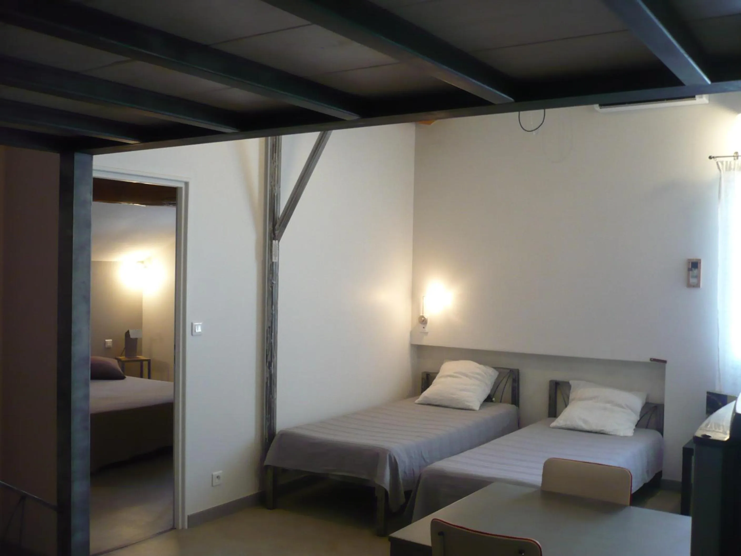 Bed in L'atelier B&B