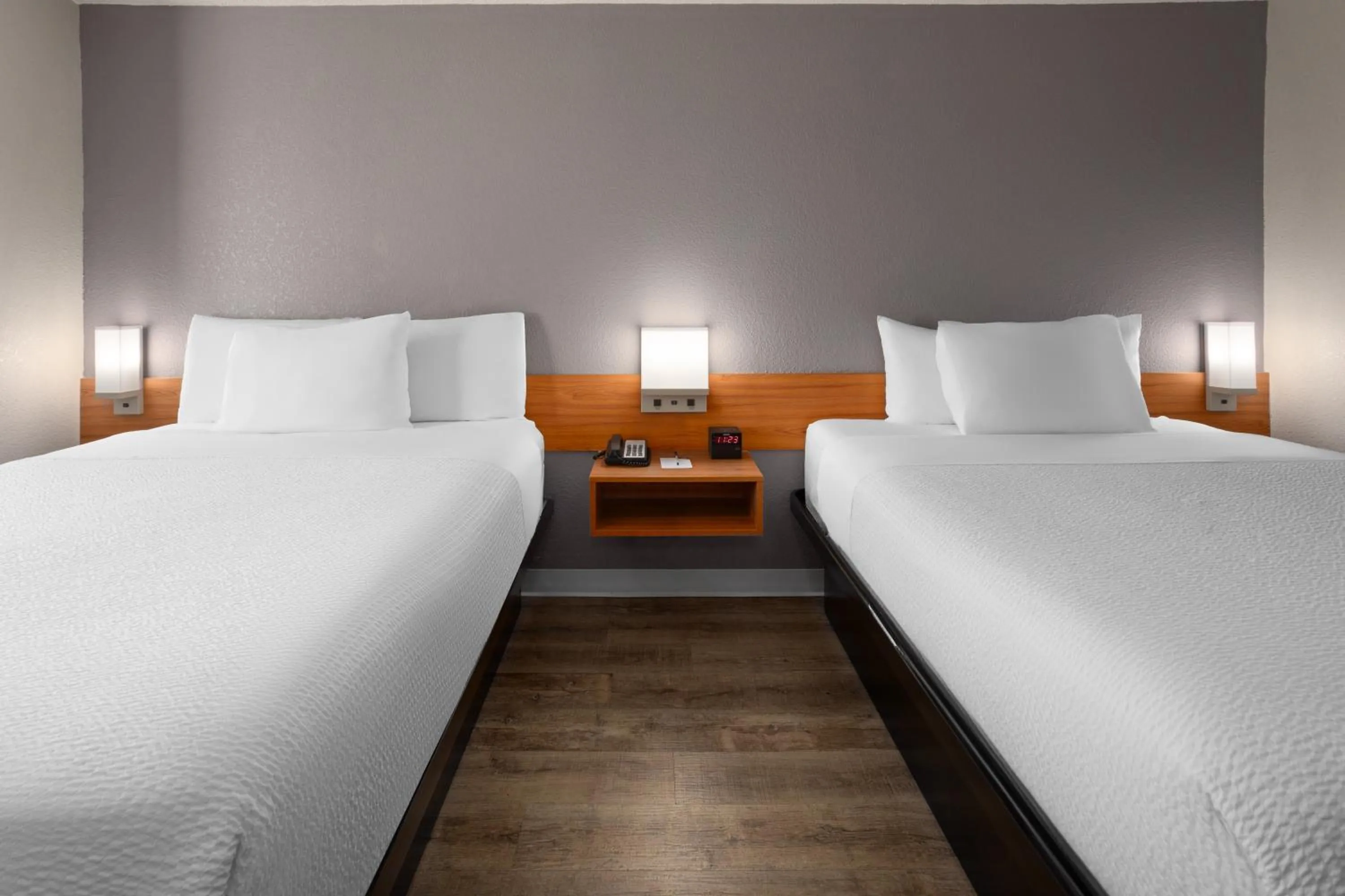 Bed in Microtel Inn & Suites by Wyndham Ann Arbor