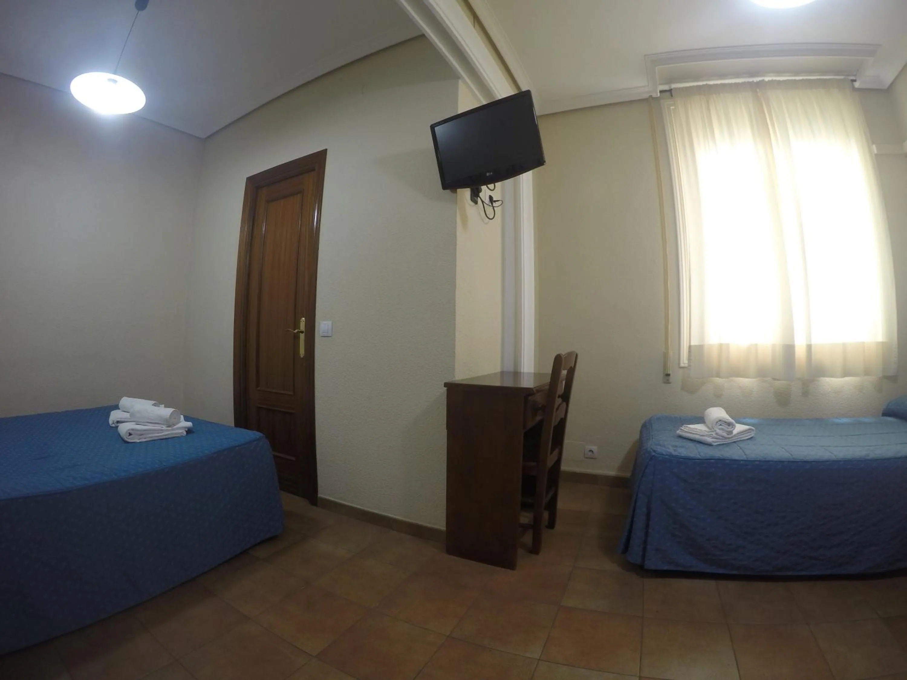 Bedroom, Bed in Hostal El Pilar