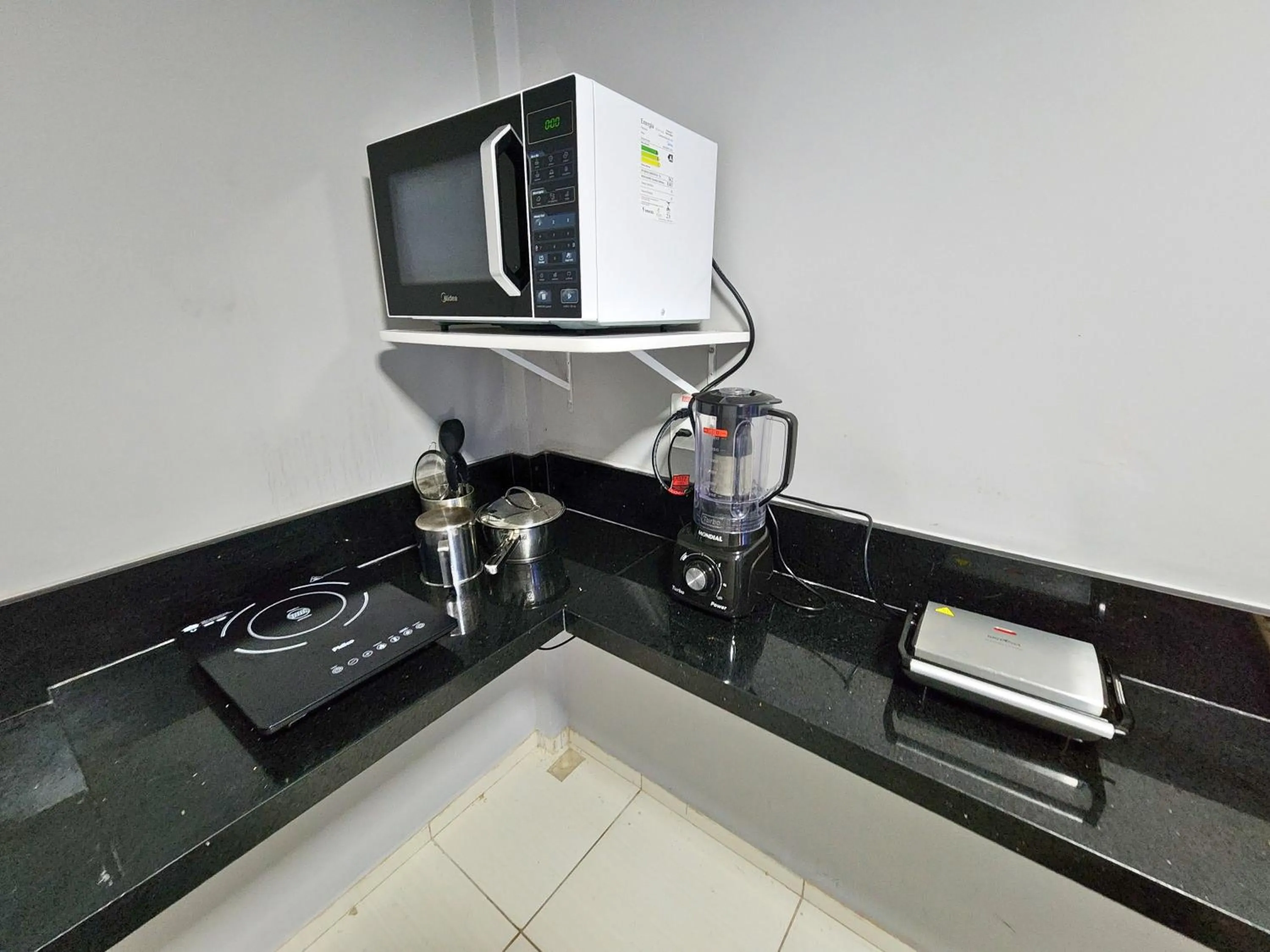 Kitchen or kitchenette in JR Hotel