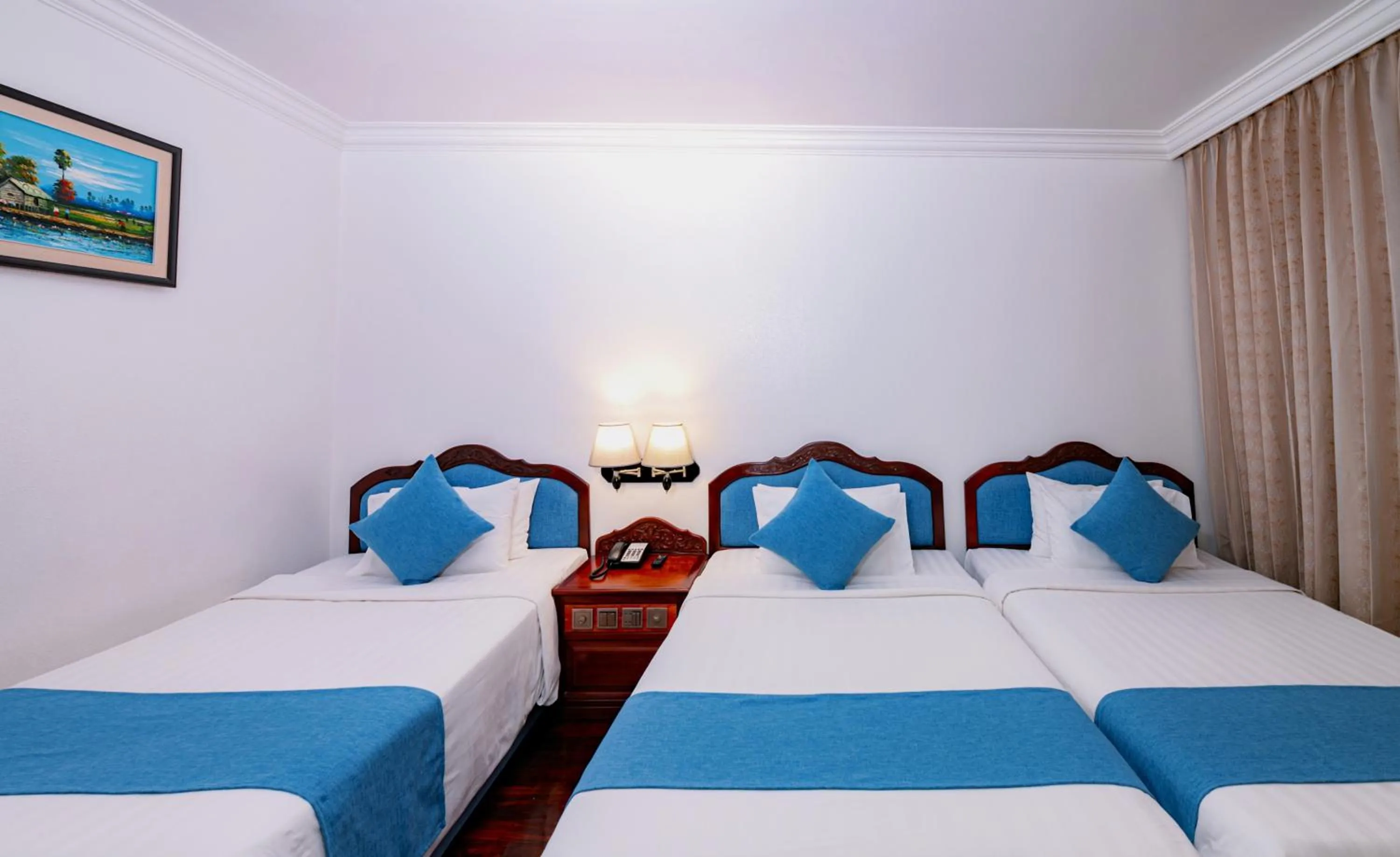 Bed in Hotel Somadevi Angkor Resort & Spa