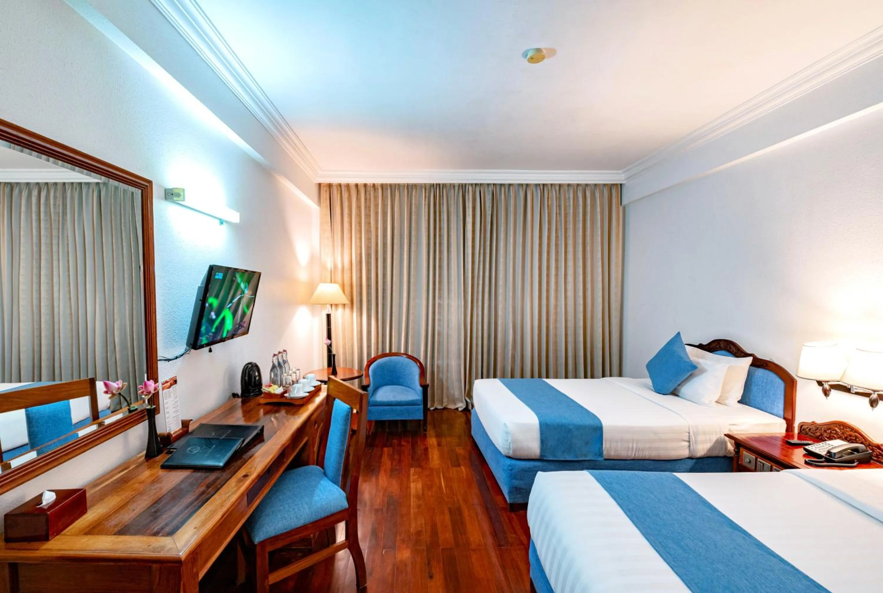 Bed in Hotel Somadevi Angkor Resort & Spa