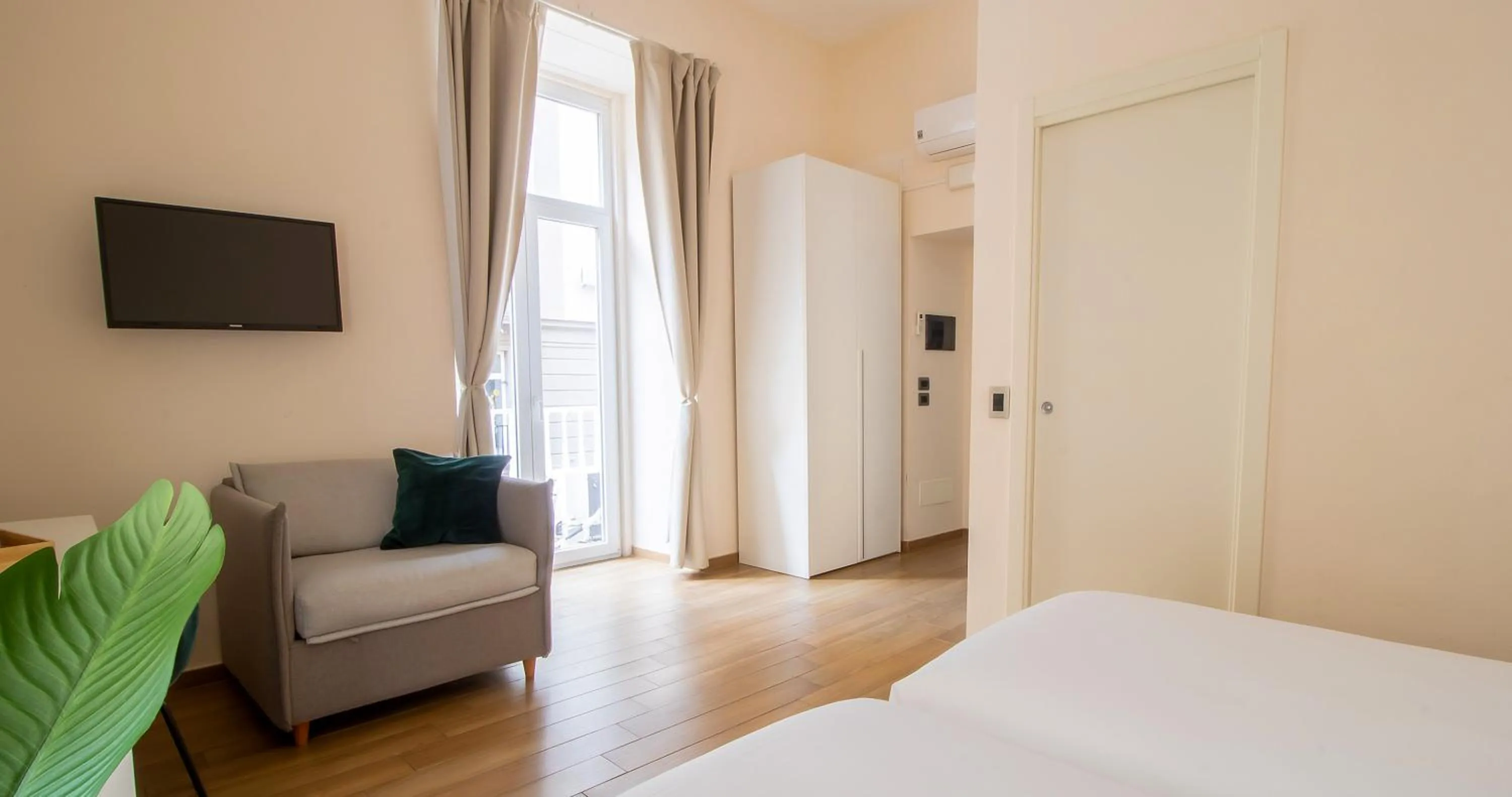 Bed in Musto Suites & Rooms