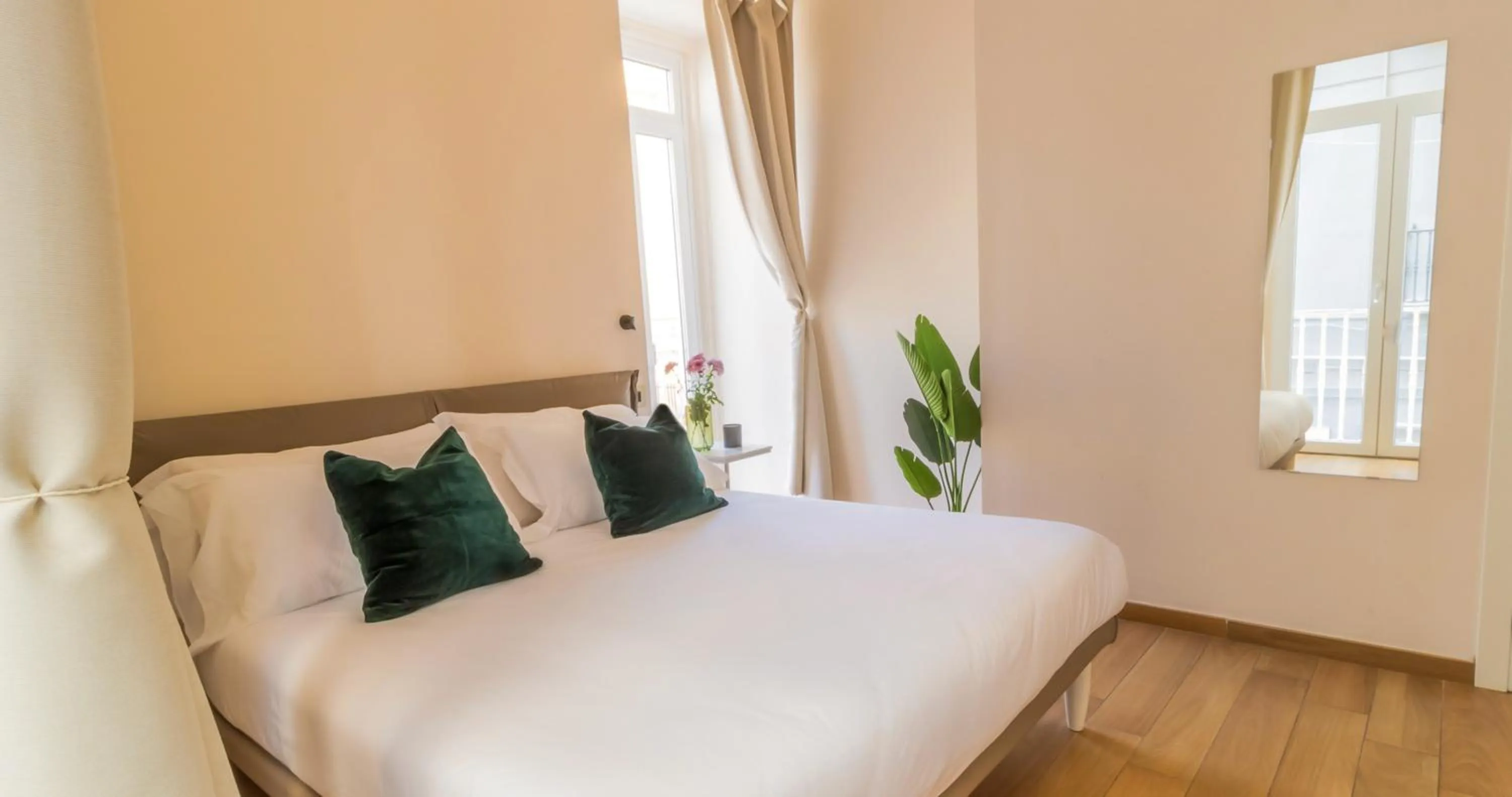 Bed in Musto Suites & Rooms