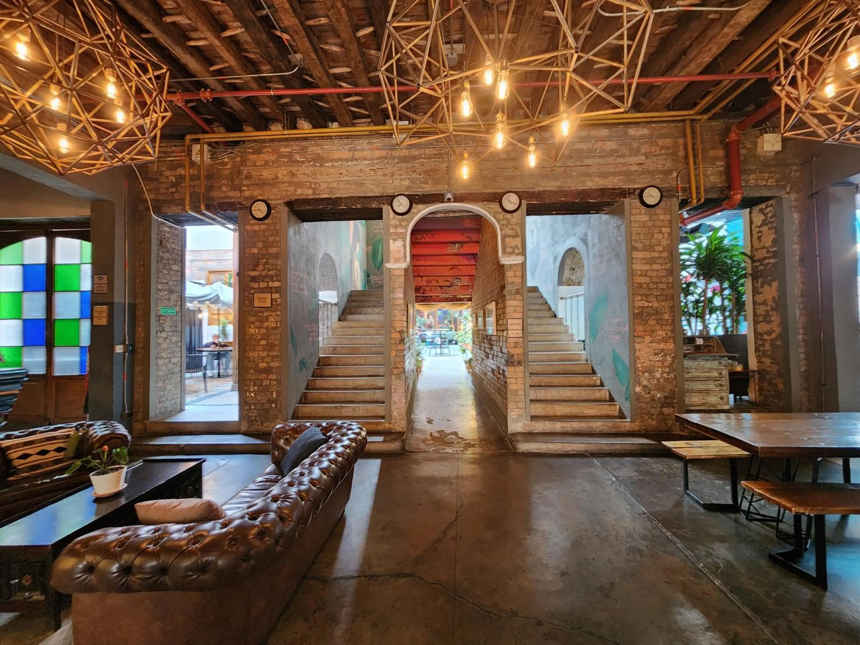 Seating area in Delgadillo Hotel by Socialtel