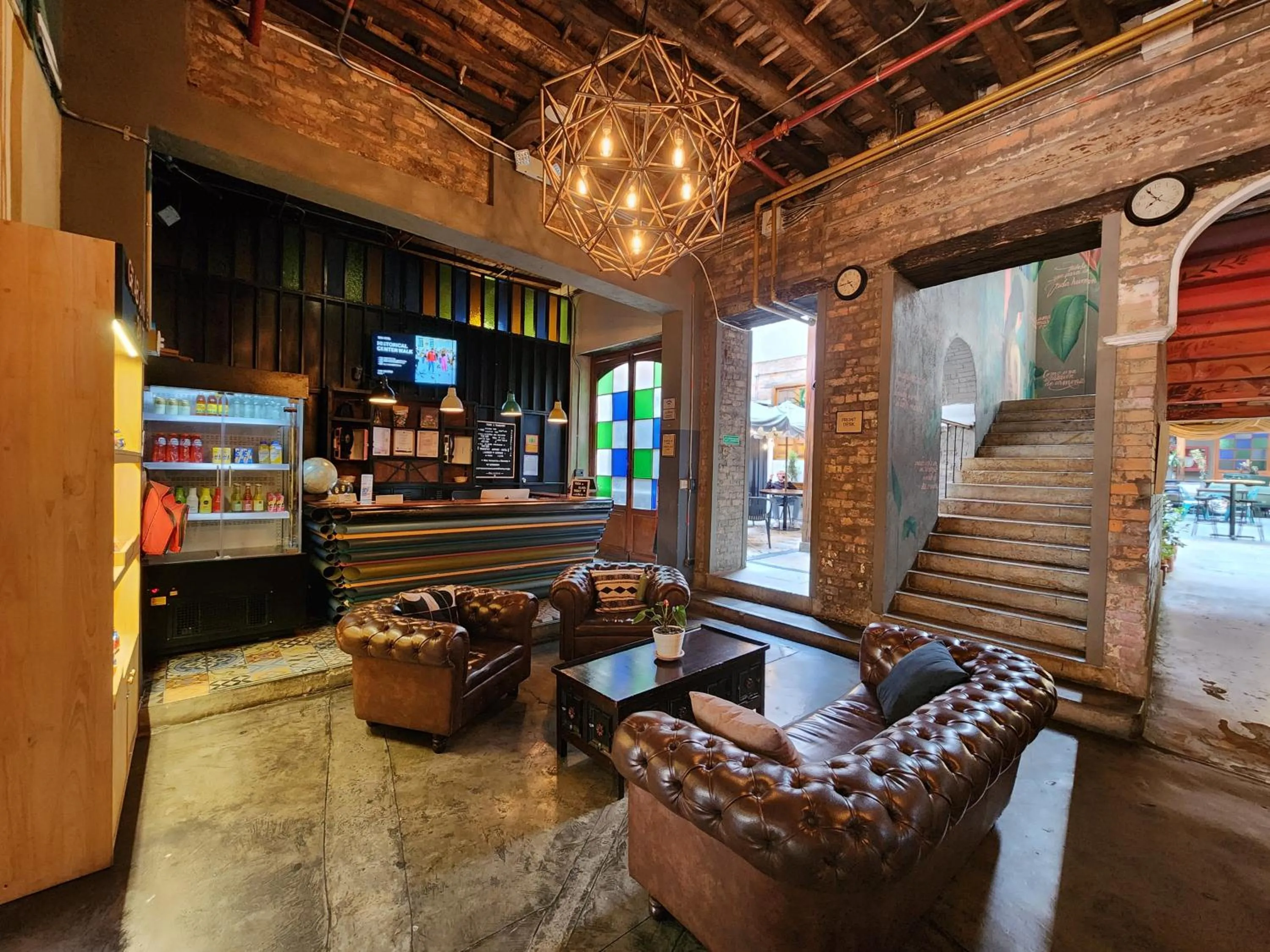 Living room in Delgadillo Hotel by Socialtel