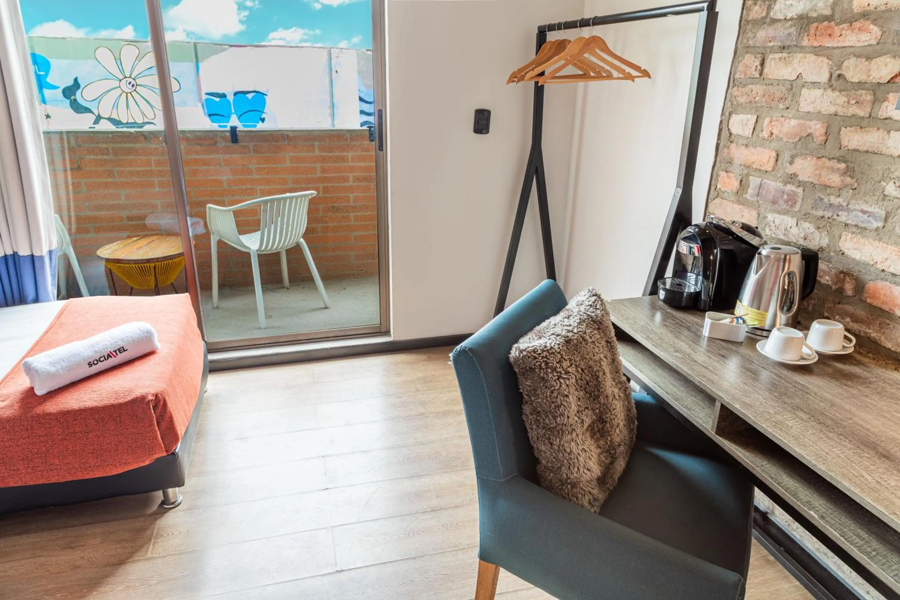 Seating area in Delgadillo Hotel by Socialtel