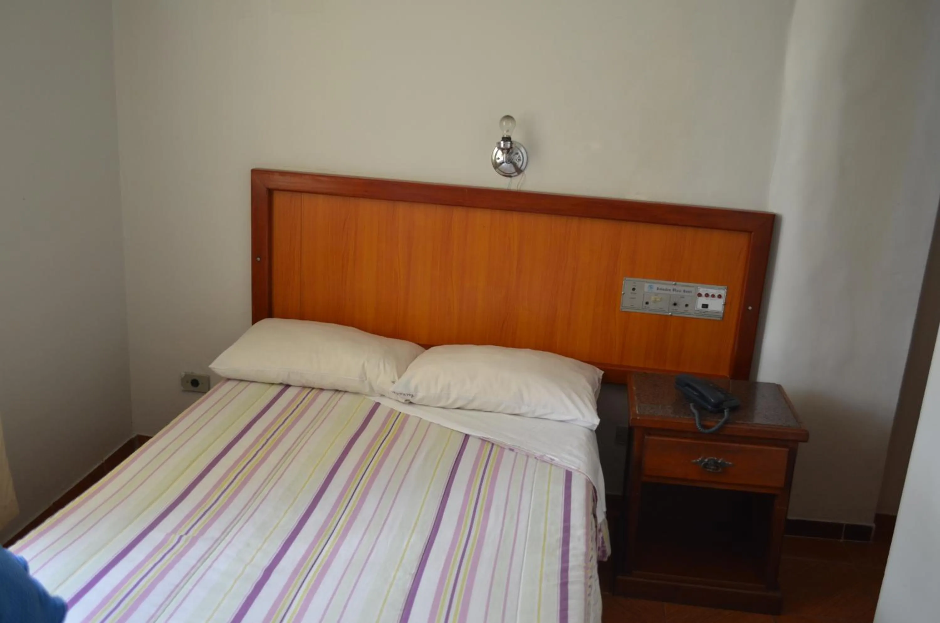 Bed in Reinales Plaza Hotel