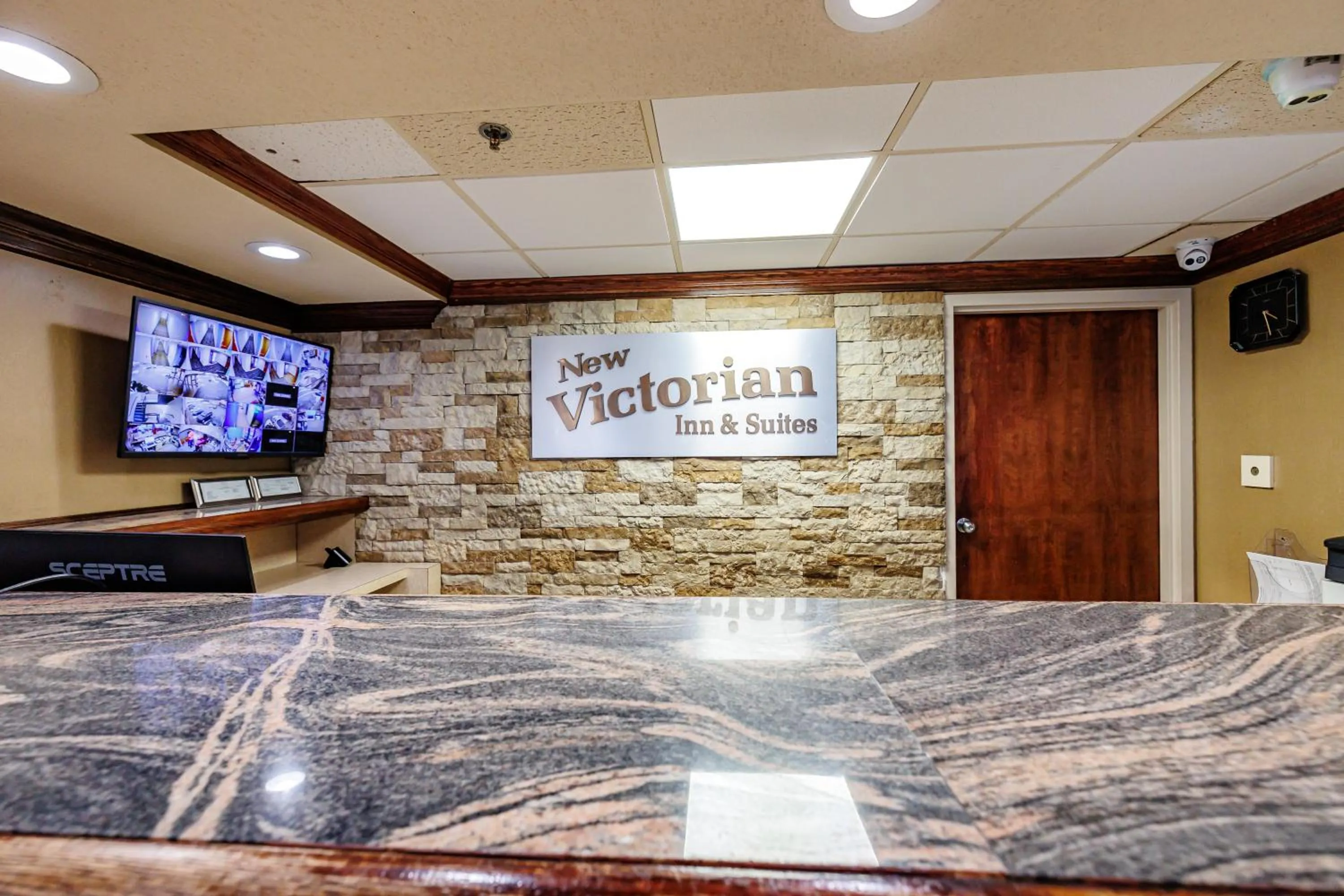 Property logo or sign in New Victorian Inn & Suites Omaha