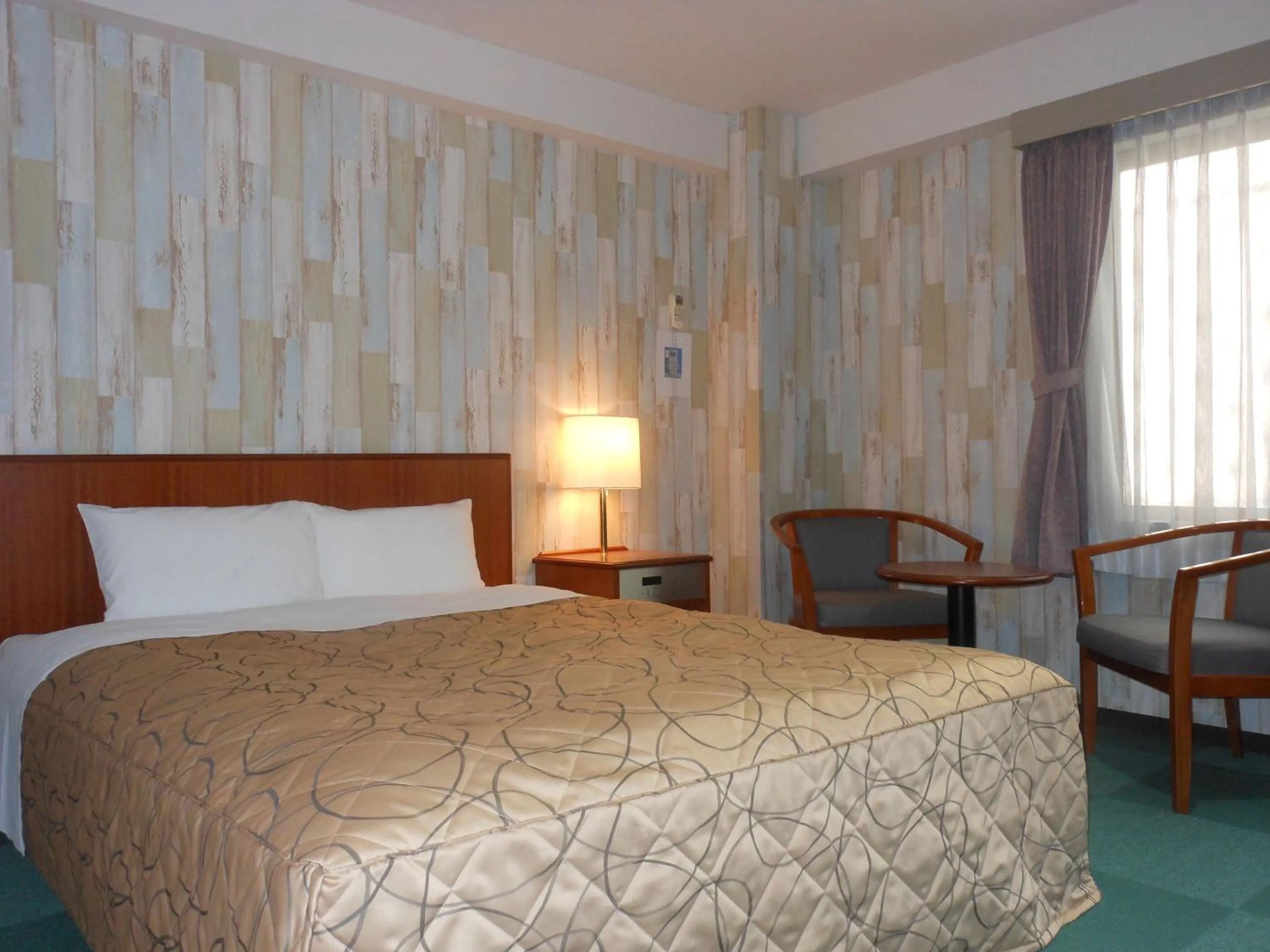 Bed in Hotel New Tohoku