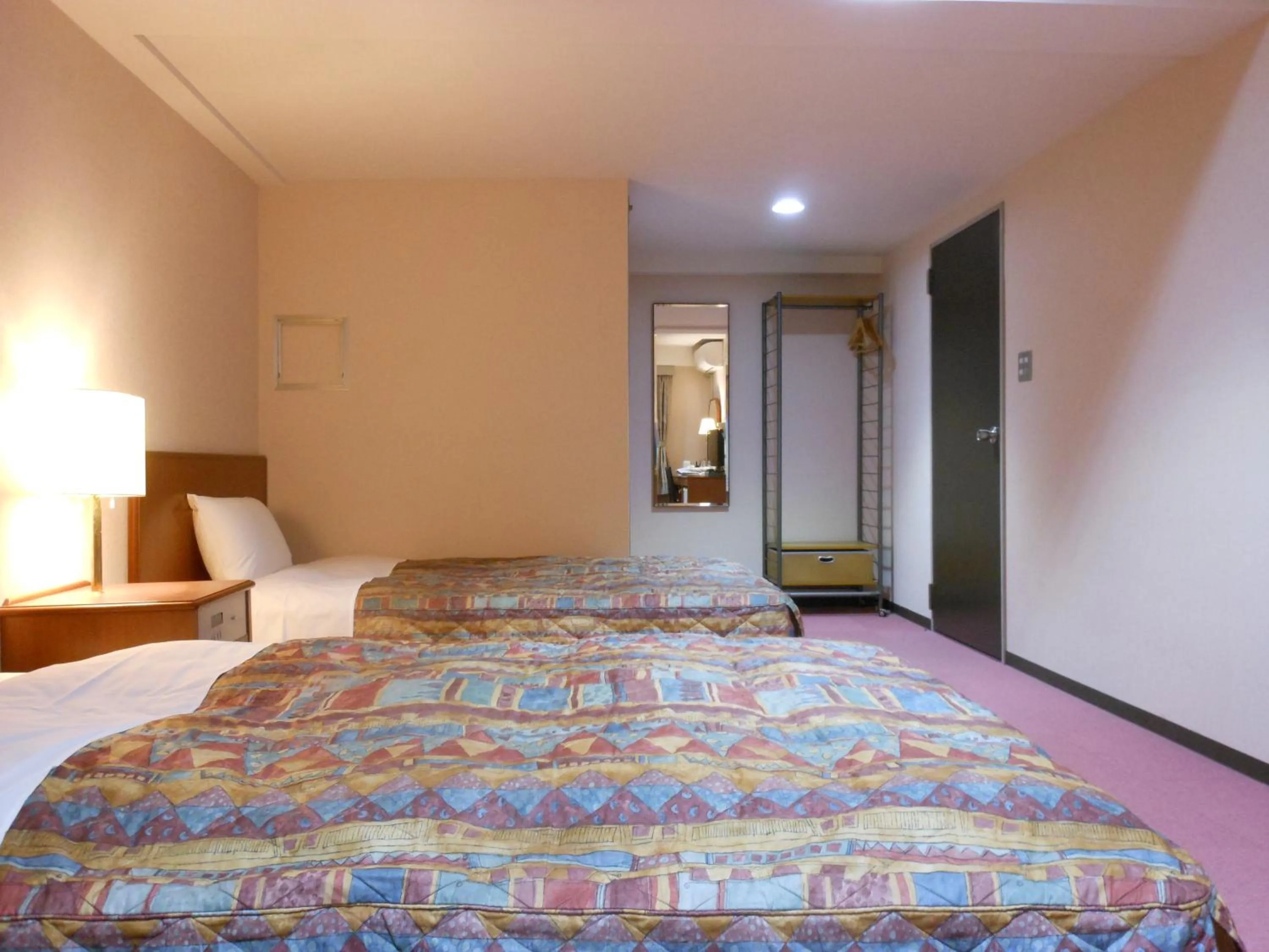 Bed in Hotel New Tohoku