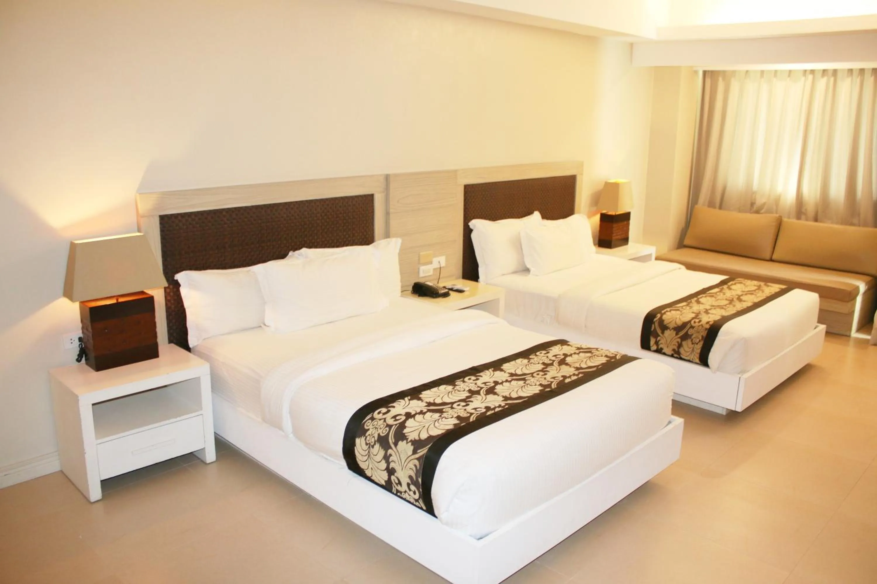 Bed in The Muse Beach Front Hotel Boracay