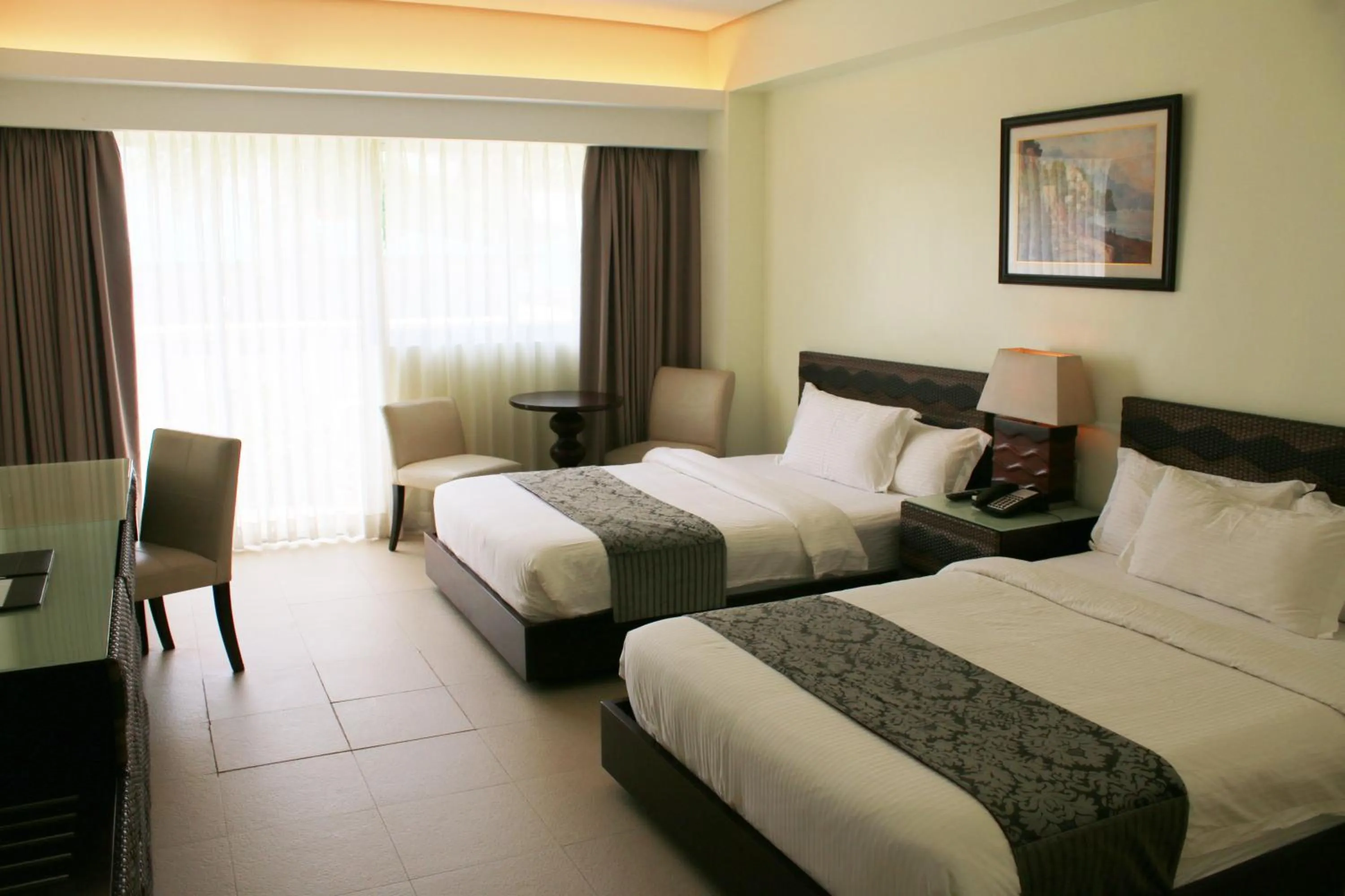 Bed in The Muse Beach Front Hotel Boracay