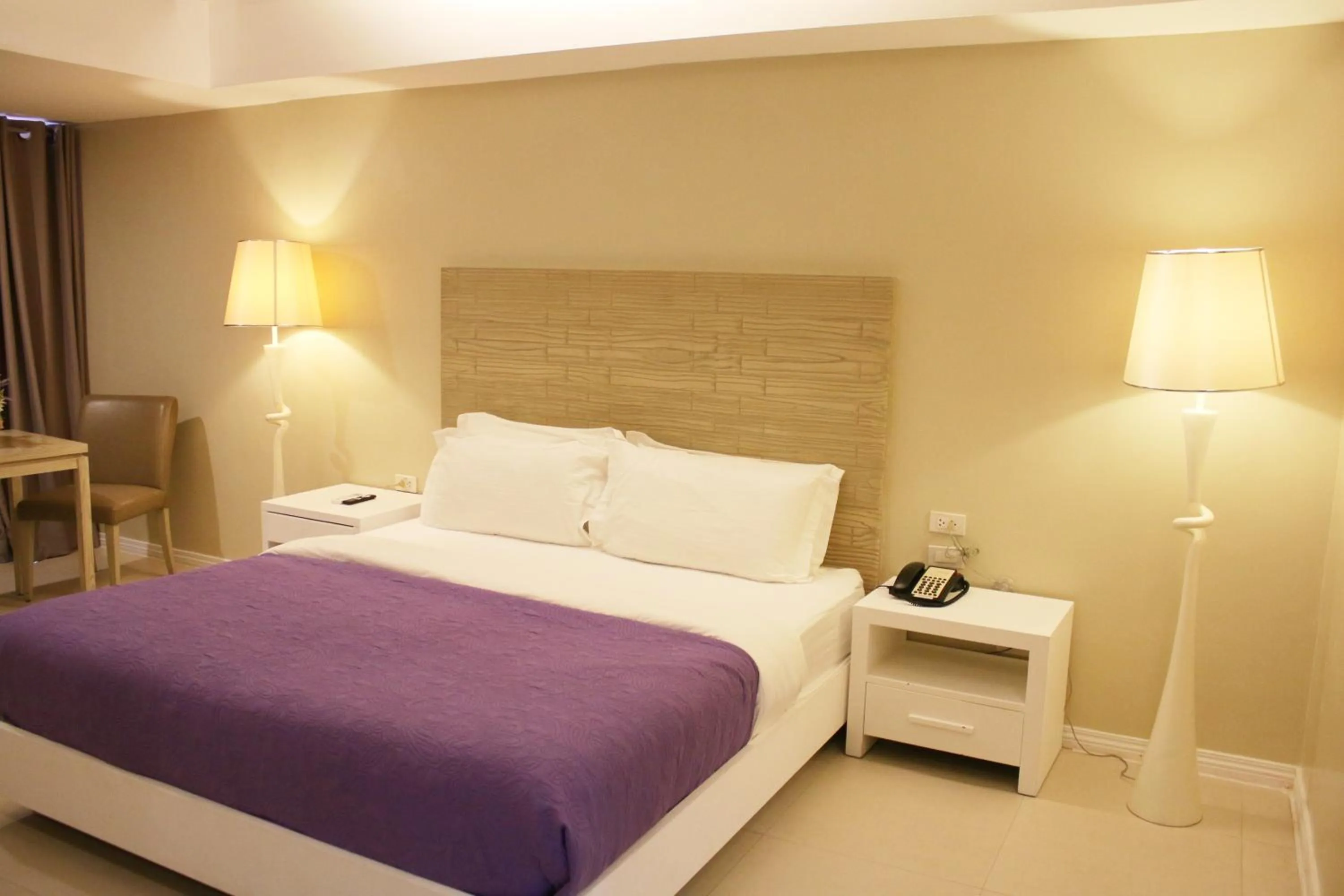 Bed in The Muse Beach Front Hotel Boracay