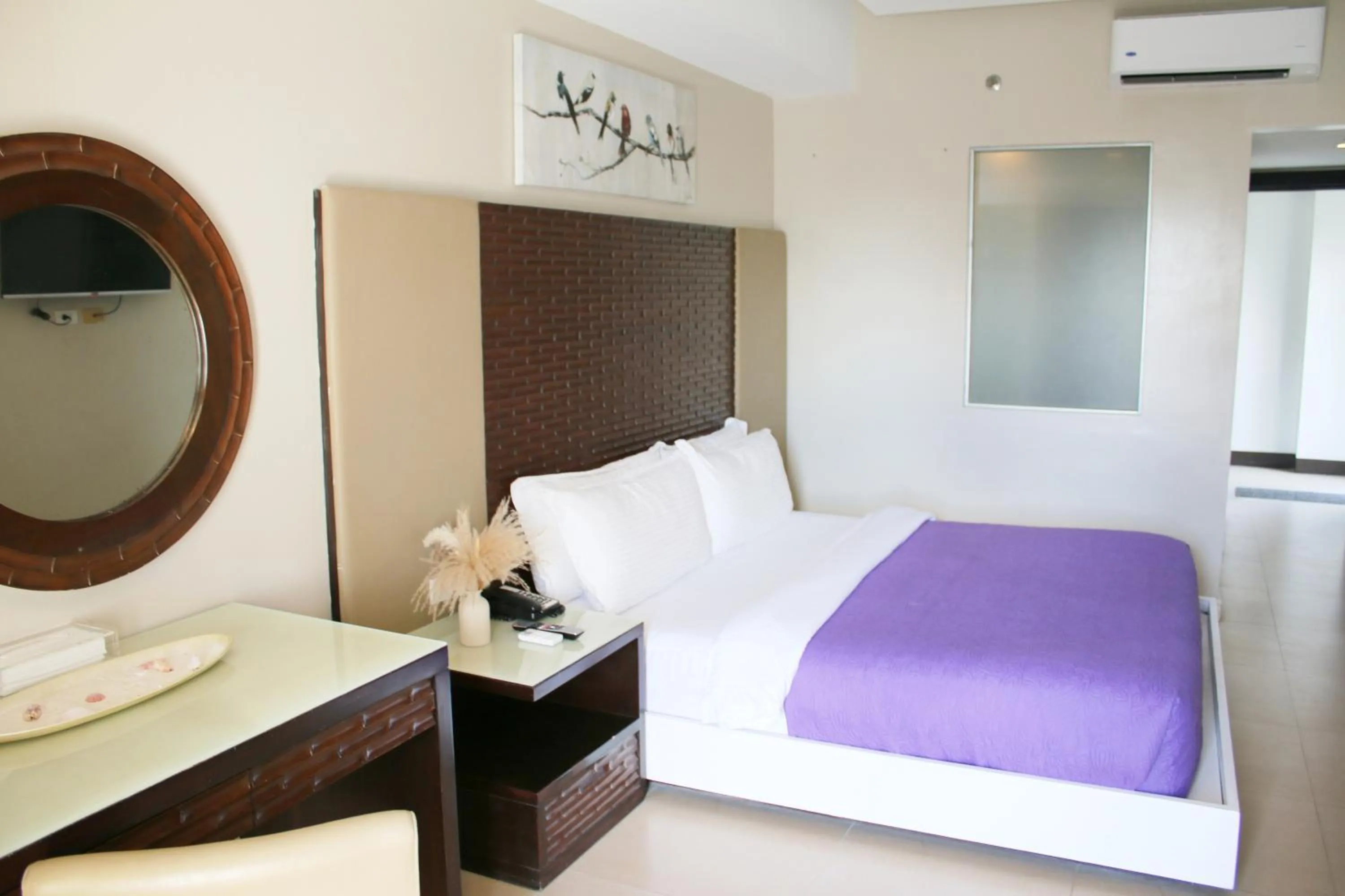 Bed in The Muse Beach Front Hotel Boracay