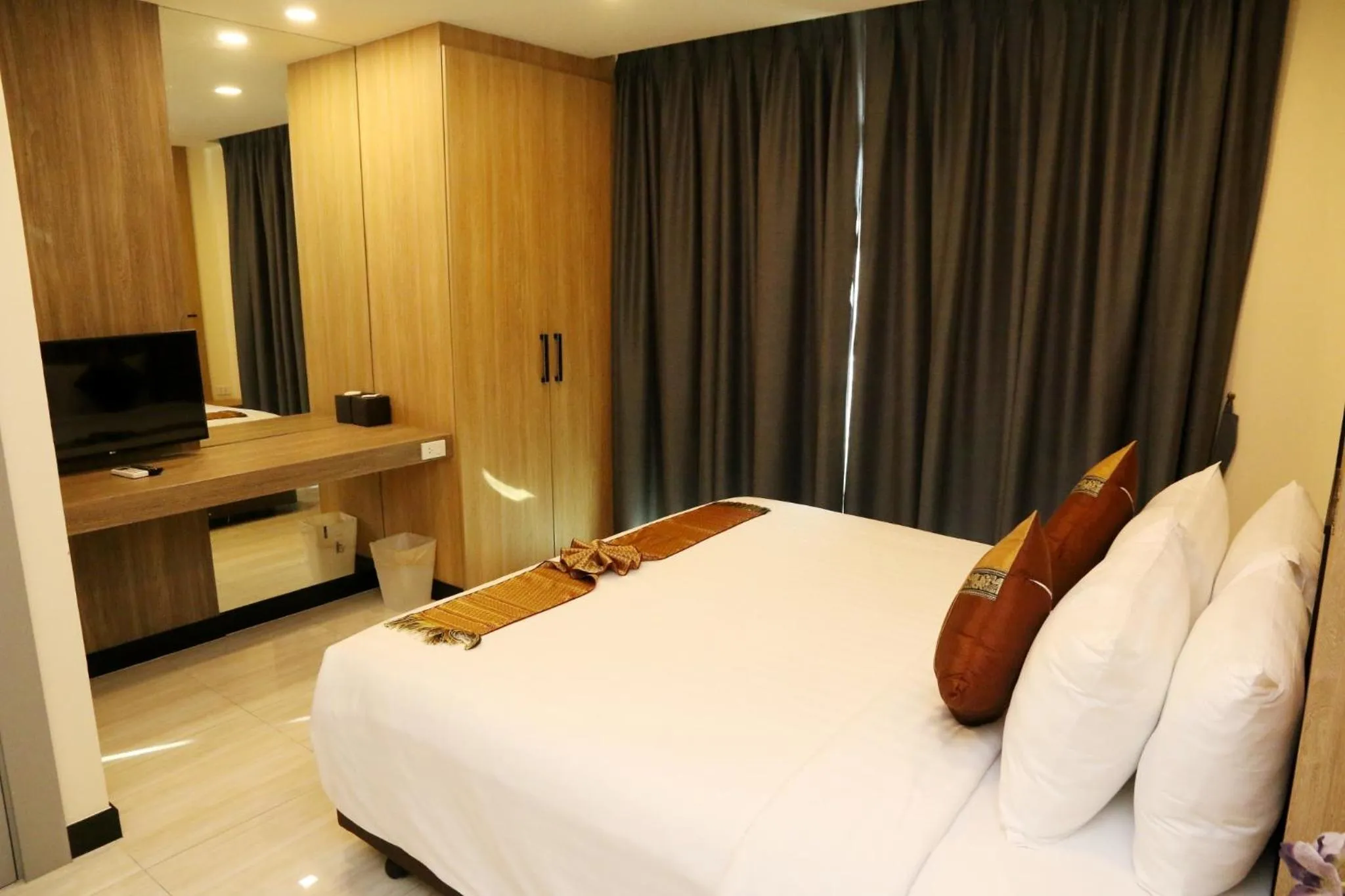 Bed in Crystal Palace Luxury Hotel Pattaya