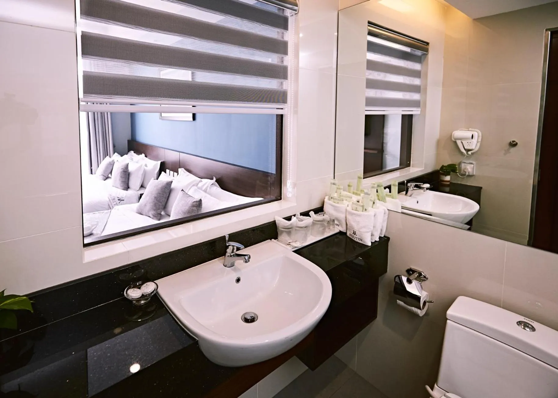 Bed in Meritin Hotel