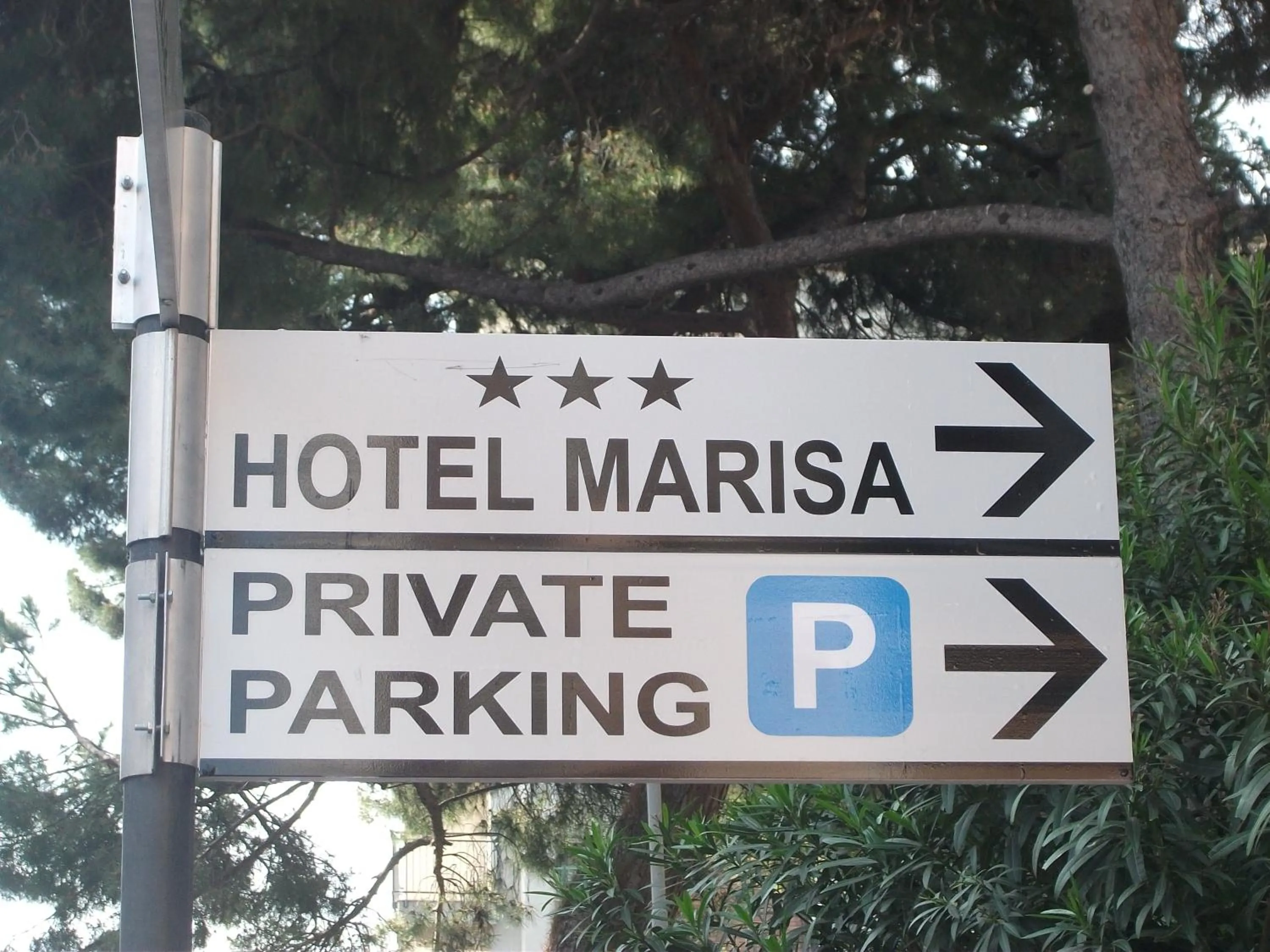 Property logo or sign in Hotel Marisa