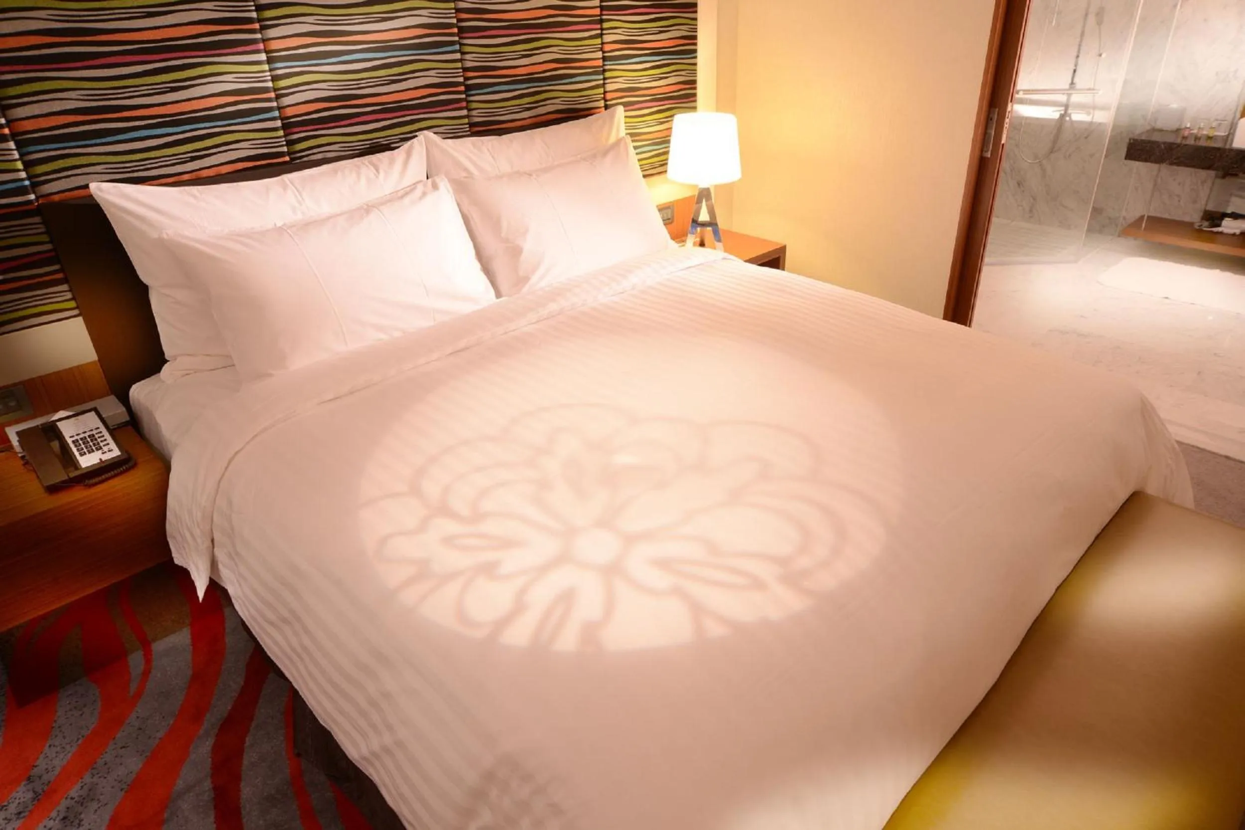 Bed in FleurLis Hotel