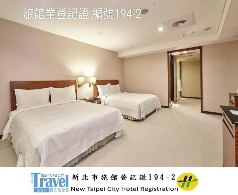 Bed in Family Hotel Taipei