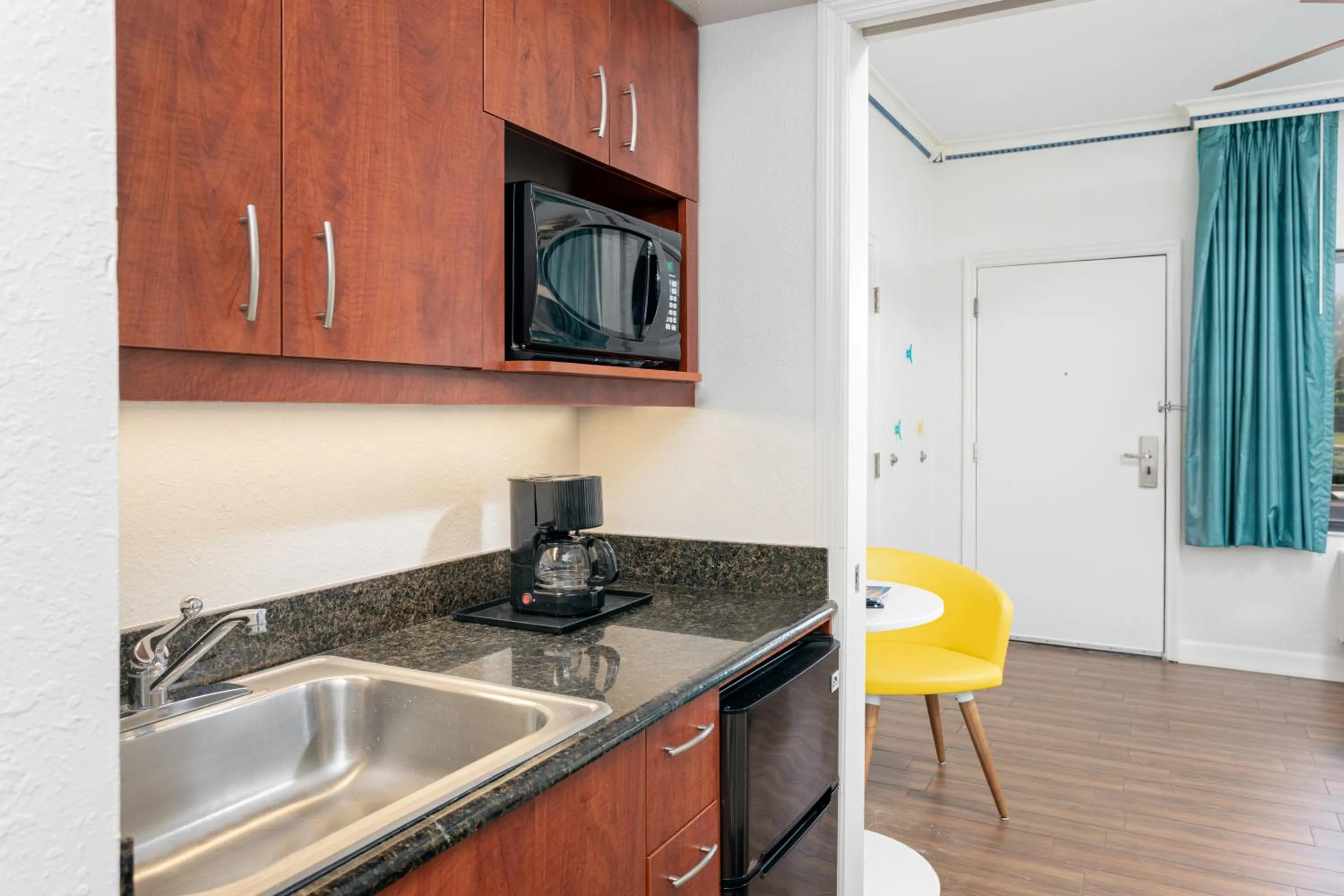 Kitchen or kitchenette in Beachside Hotel & Suites Cocoa Beach - Port Canaveral