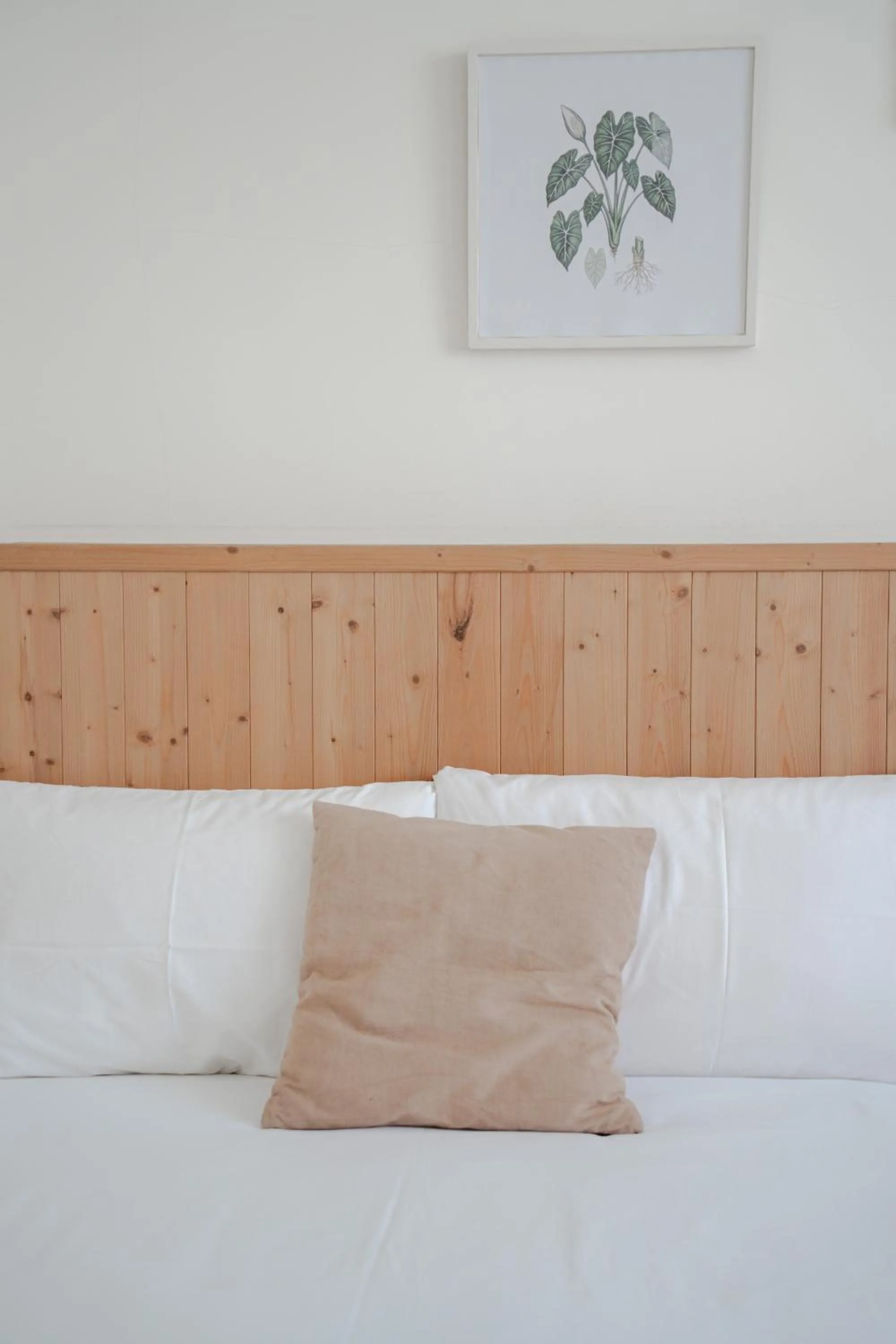 Bed in Cozy Green Guesthouse