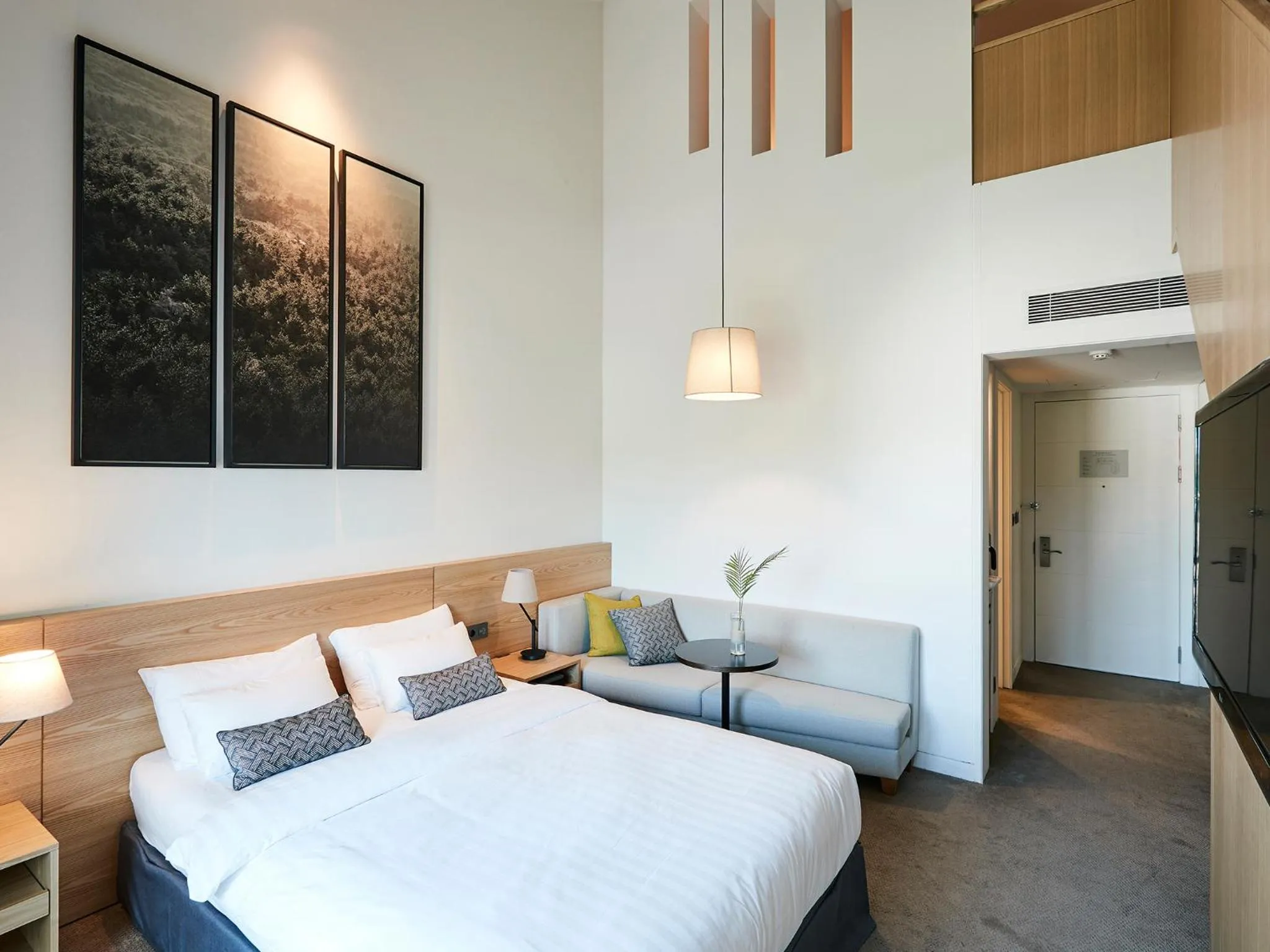 Bed in The Suites Hotel Jeju