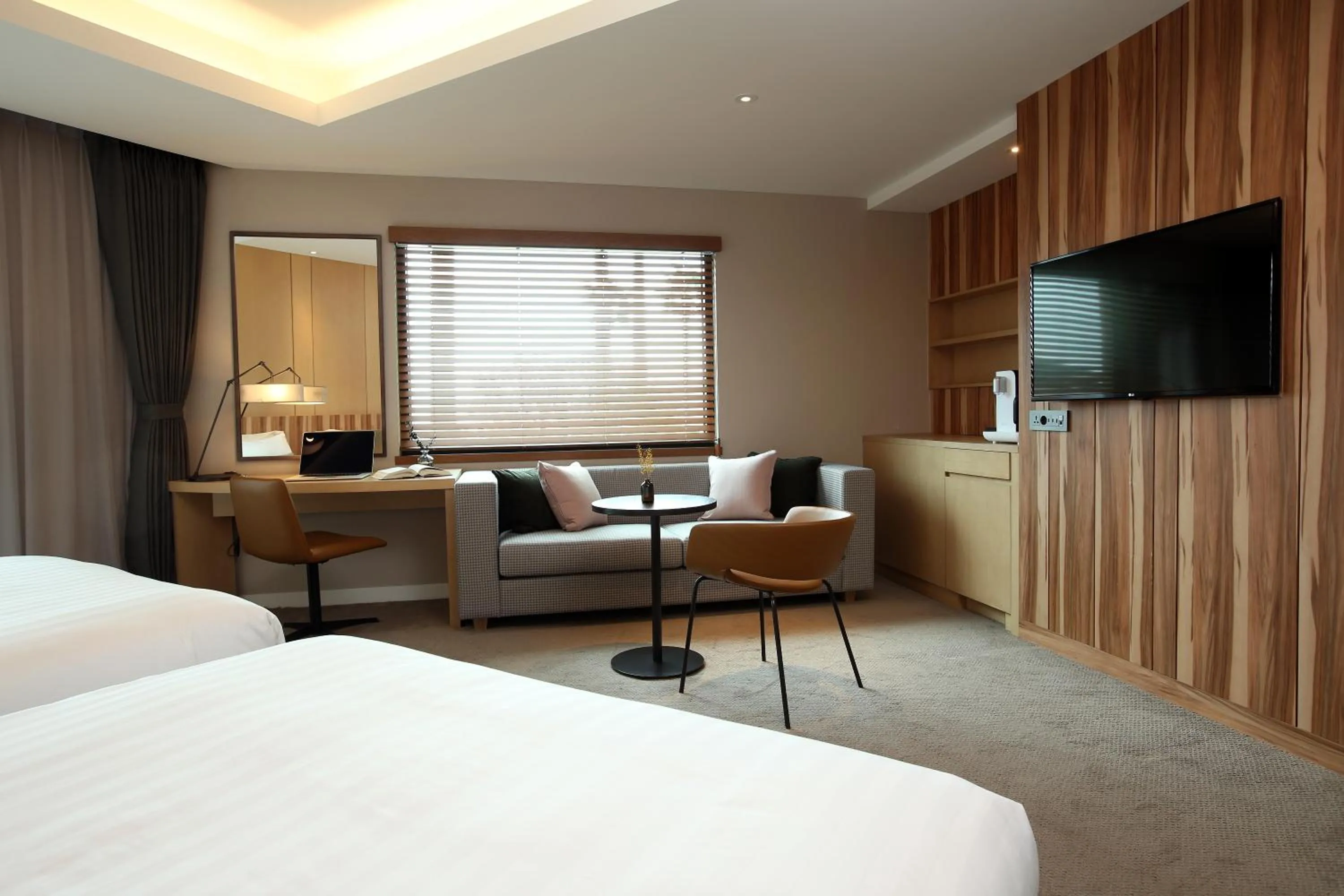 Bed in The Suites Hotel Jeju