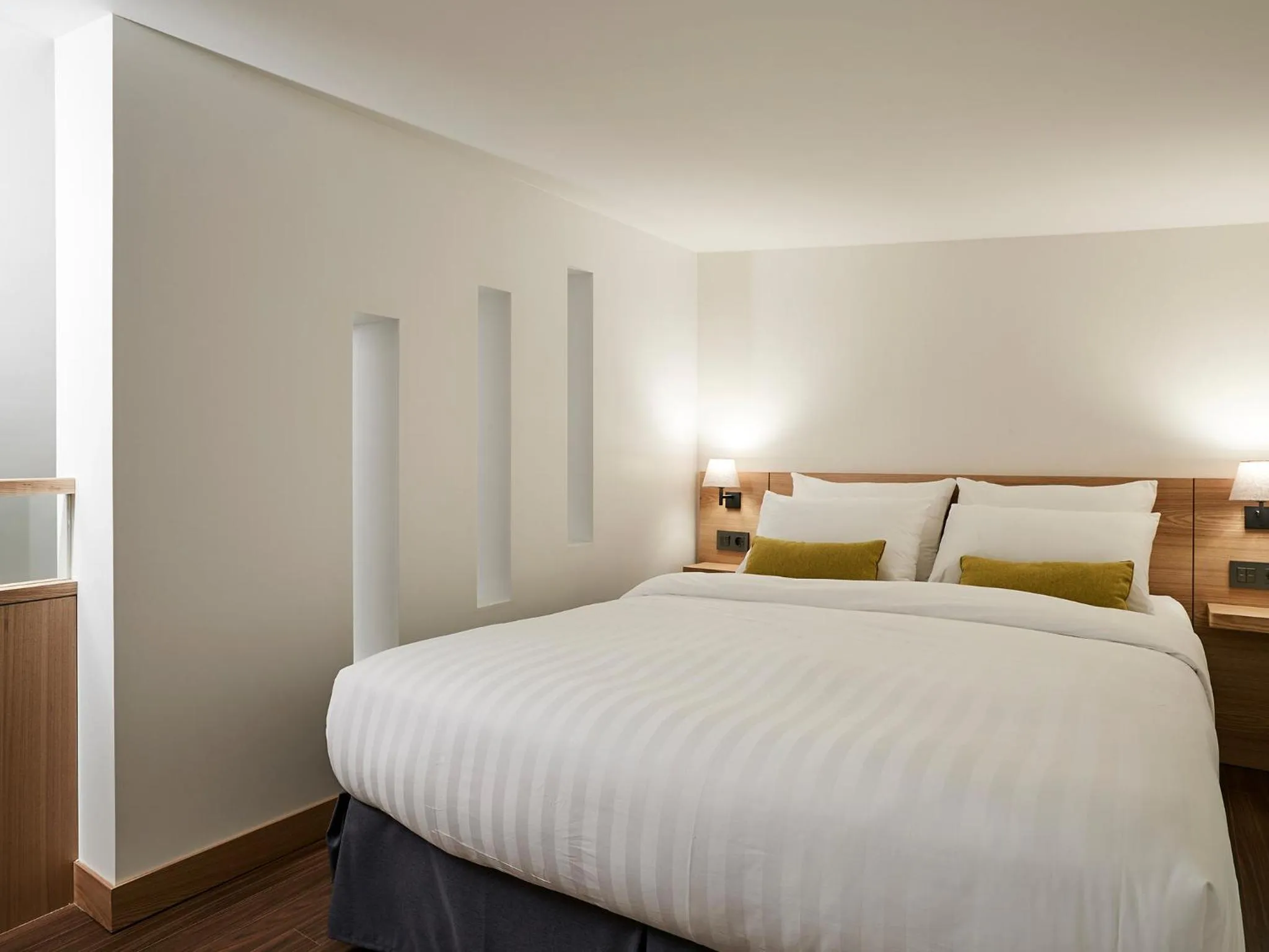 Bed in The Suites Hotel Jeju