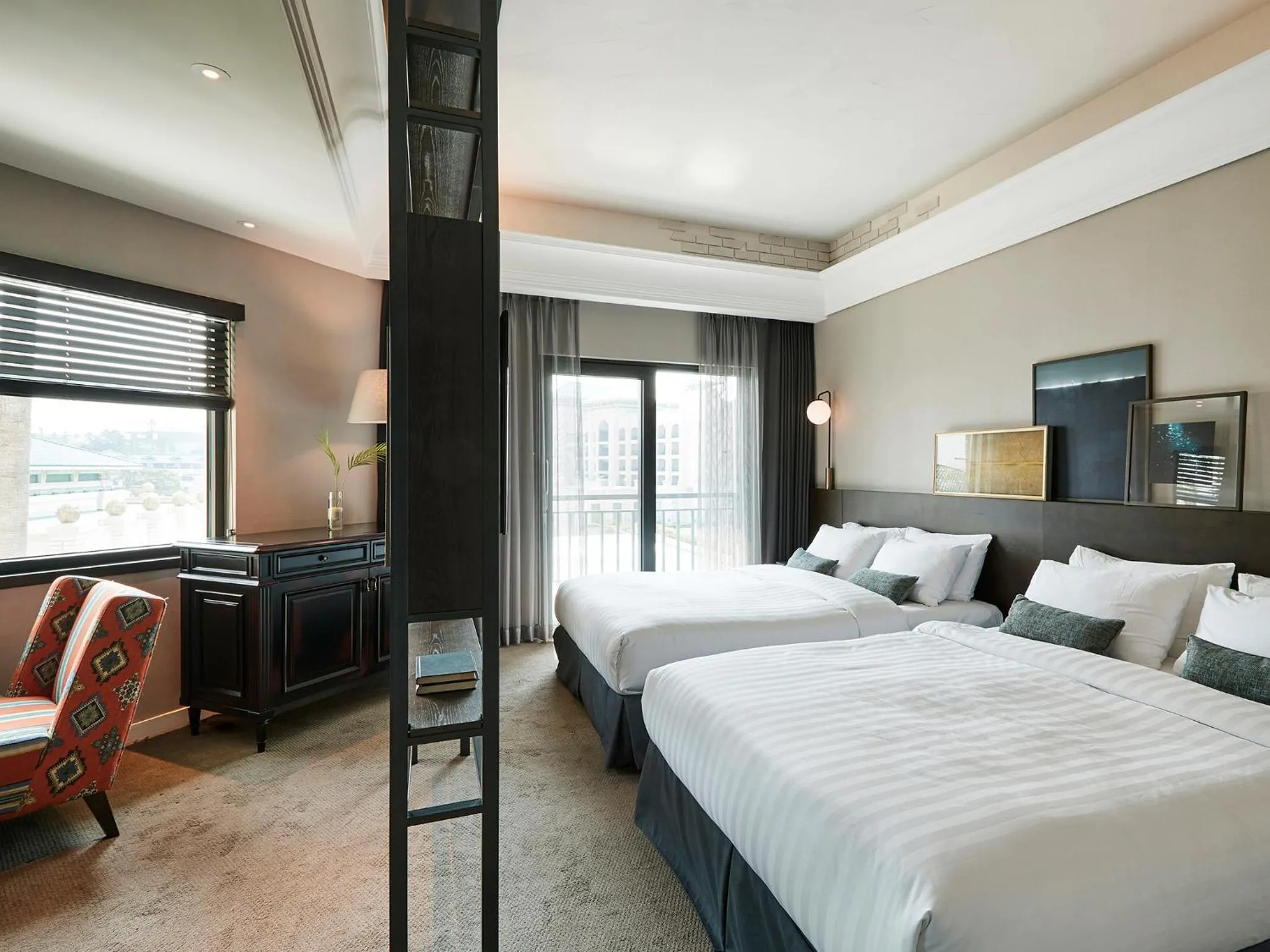 Bed in The Suites Hotel Jeju