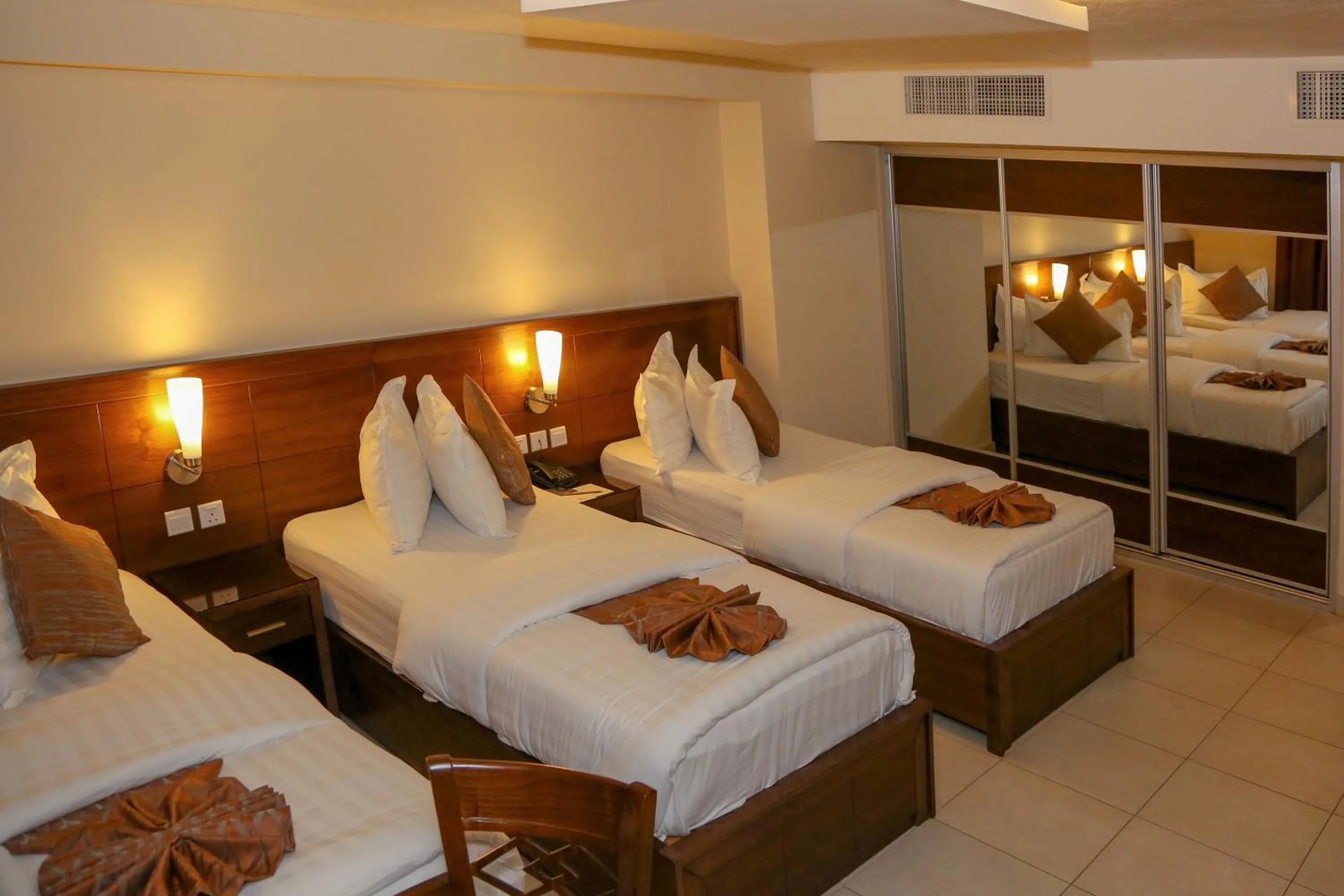 Bed in City Tower Hotel