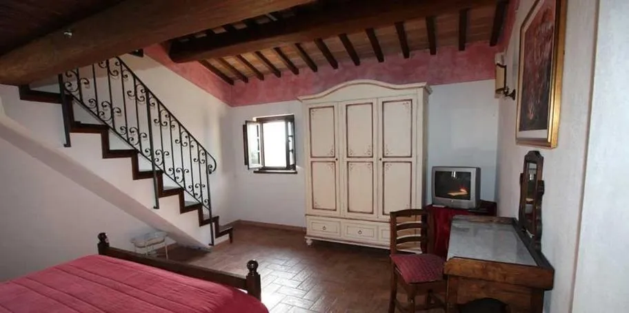 Bed in Terre Del Cantico Country House