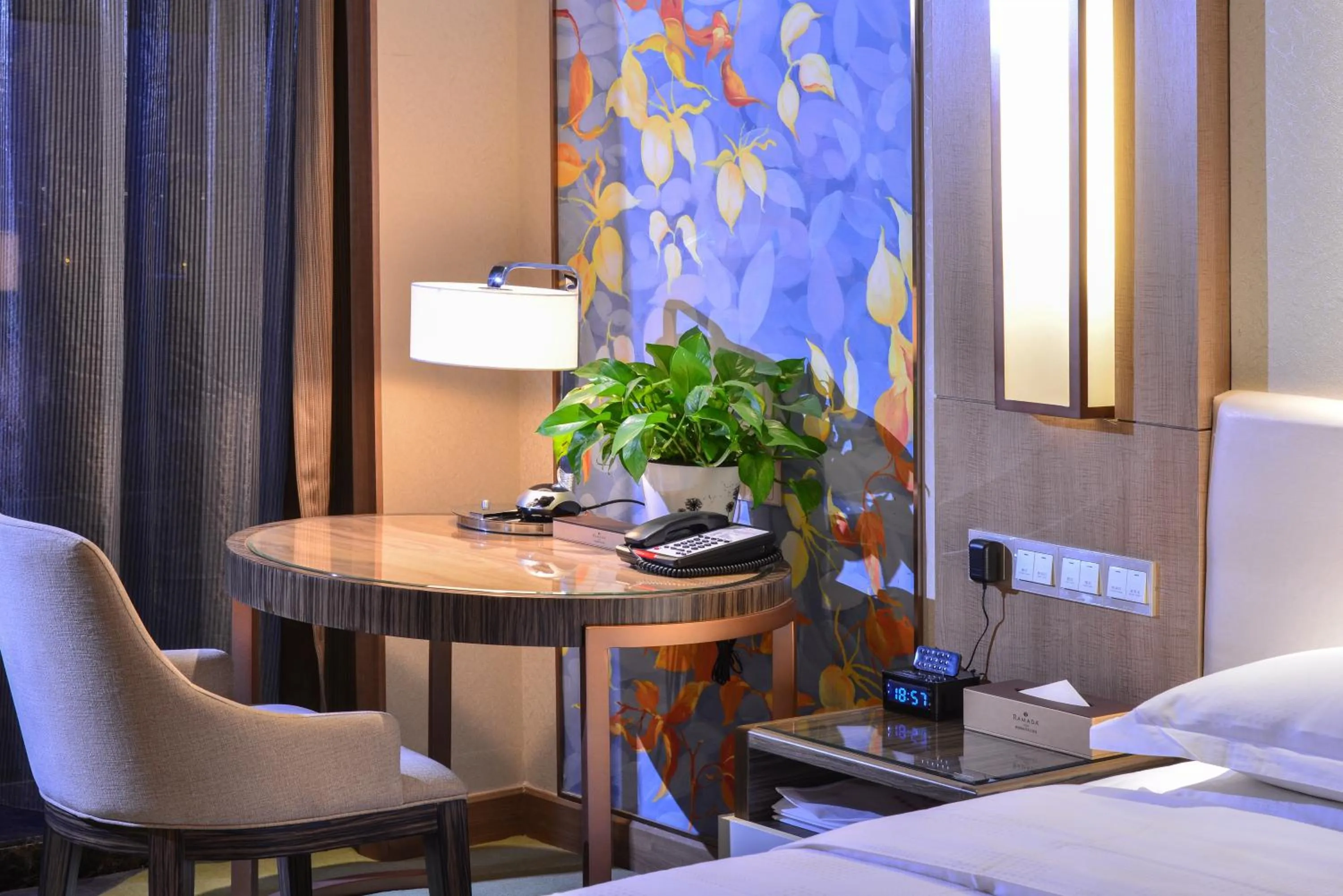 Seating area, Bed in Ramada Heze