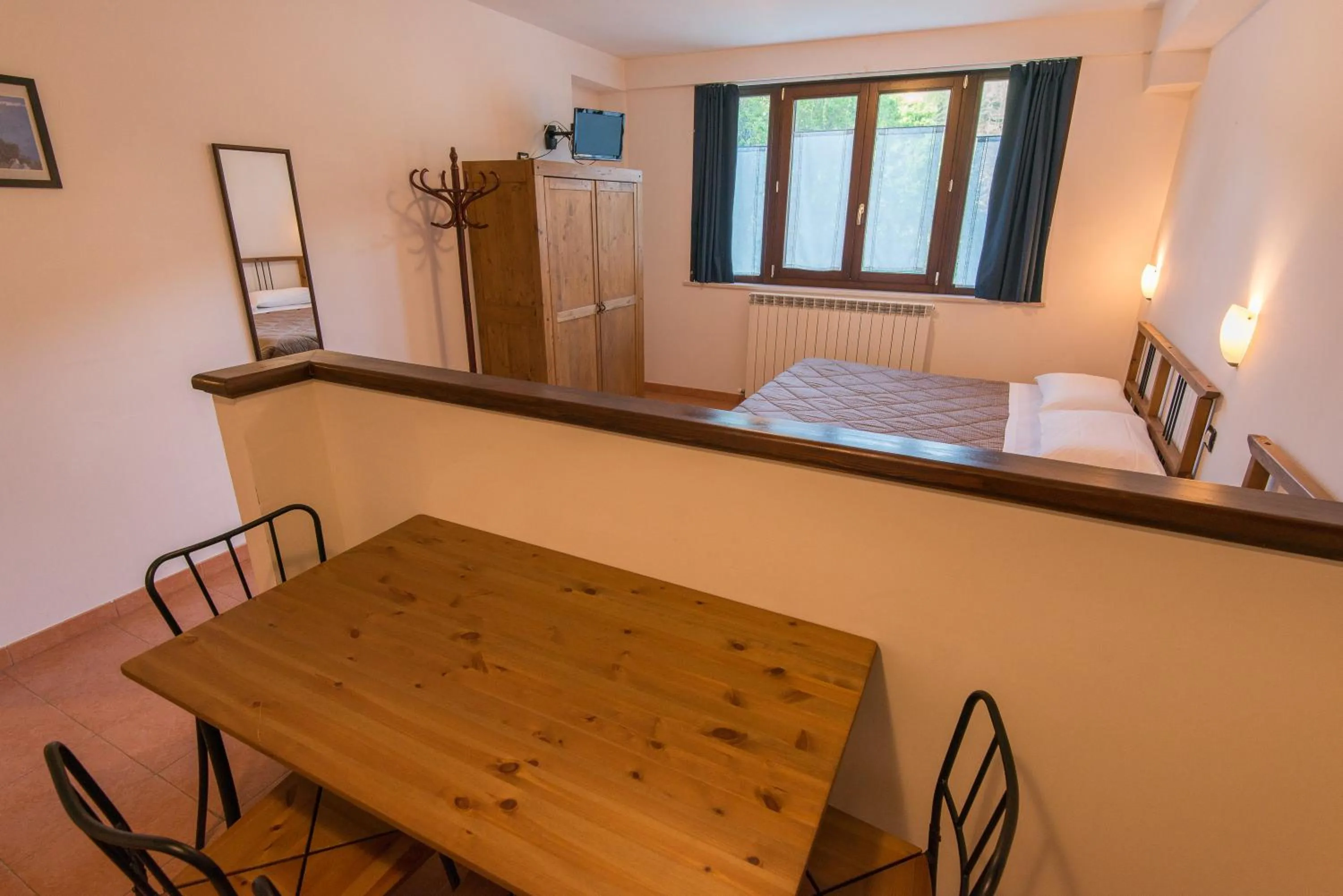 Kitchen or kitchenette, Bed in Albergo Della Corte