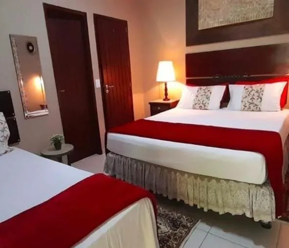 Bed in Suítes Bouganville