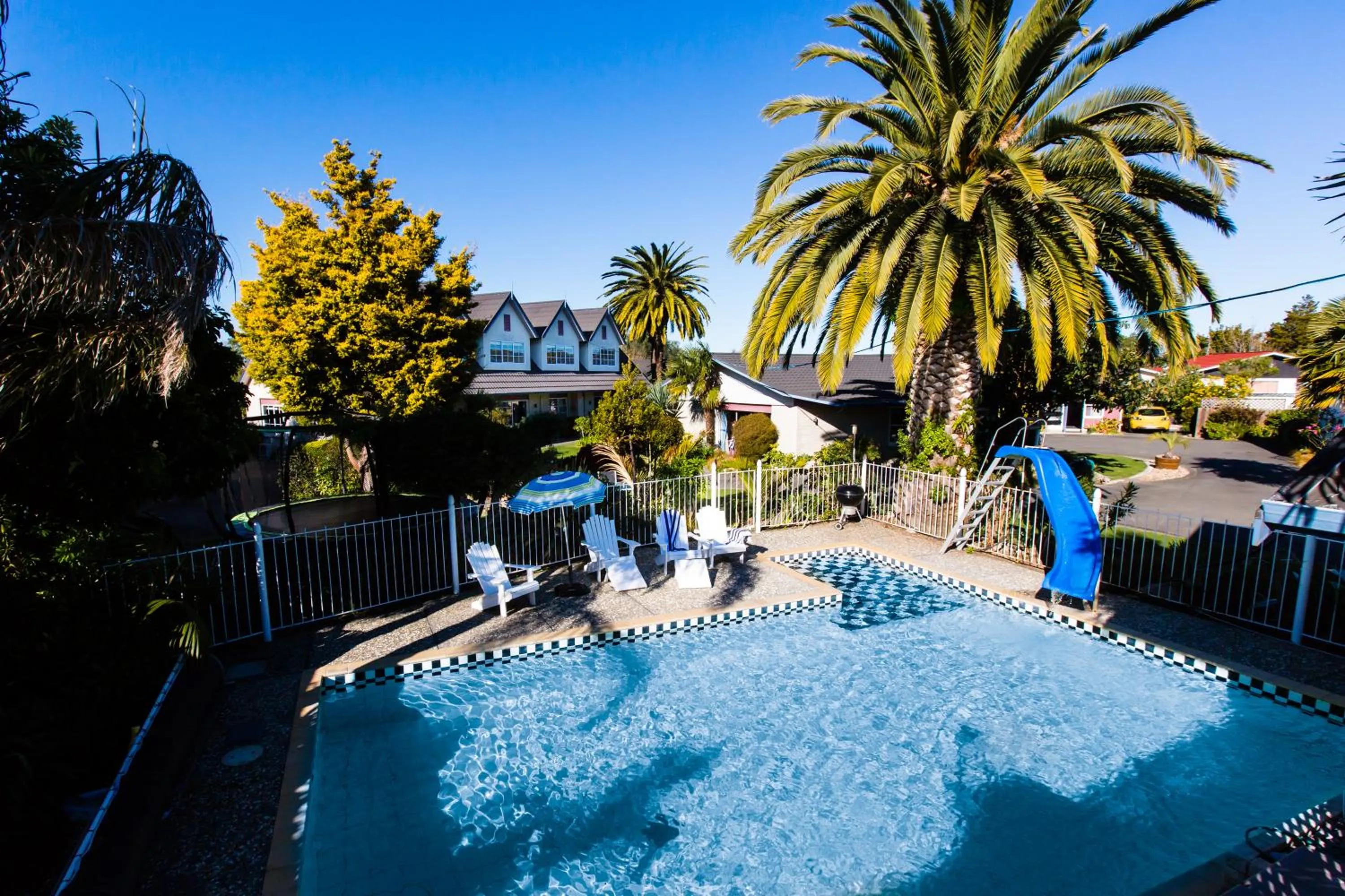 Swimming pool in ASURE Colonial Lodge Motel