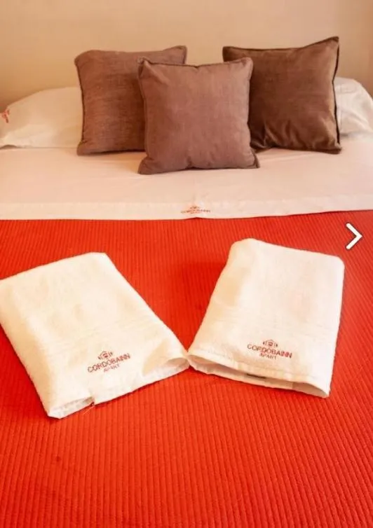 Bed in Cordoba Inn Apart Hotel