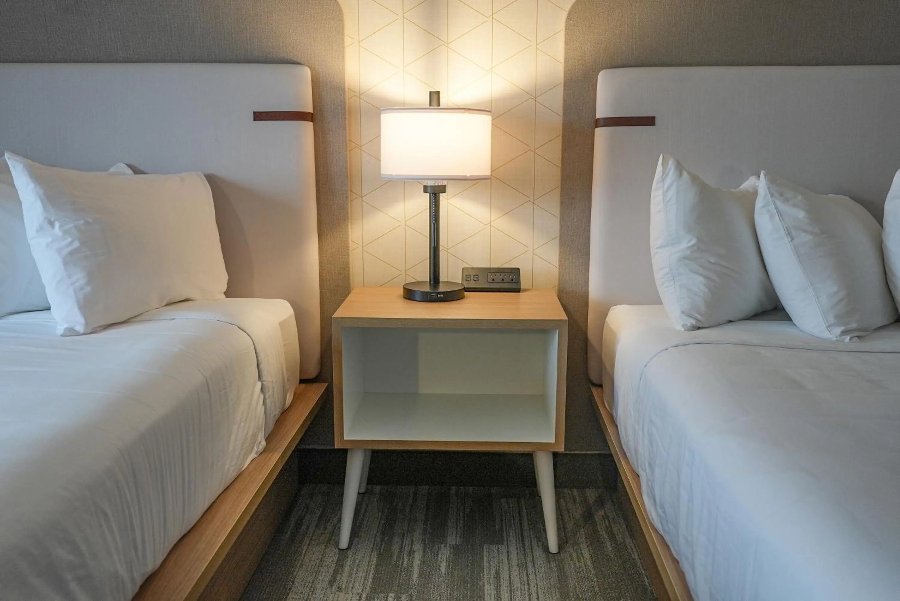 Bed in The Boulevard Hotel