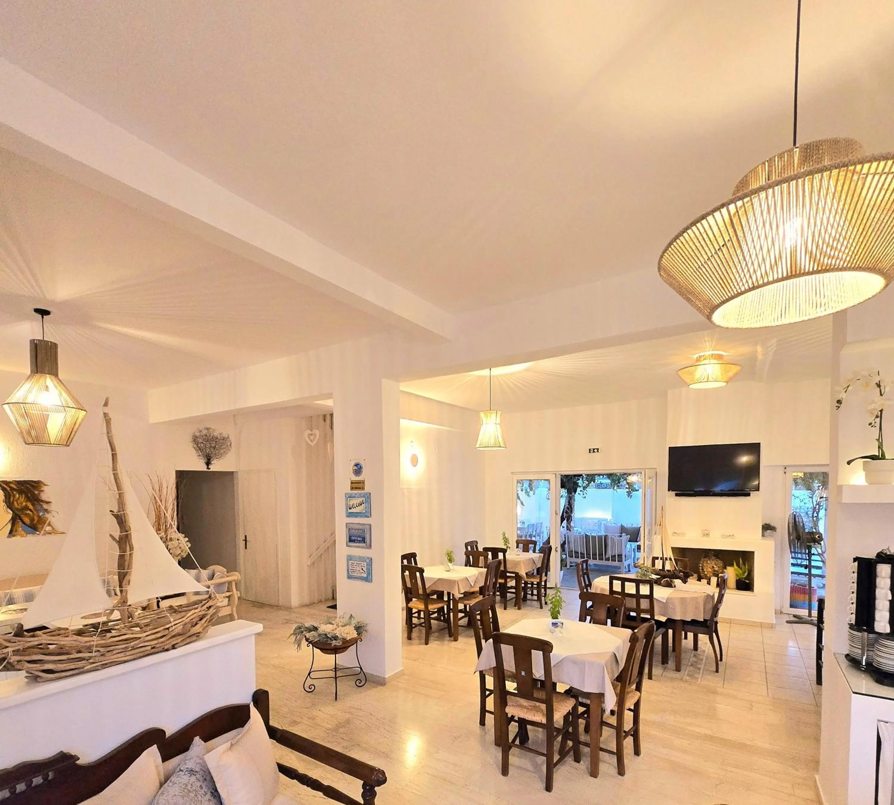 Communal lounge/ TV room in Aphrodite Boutique Hotel