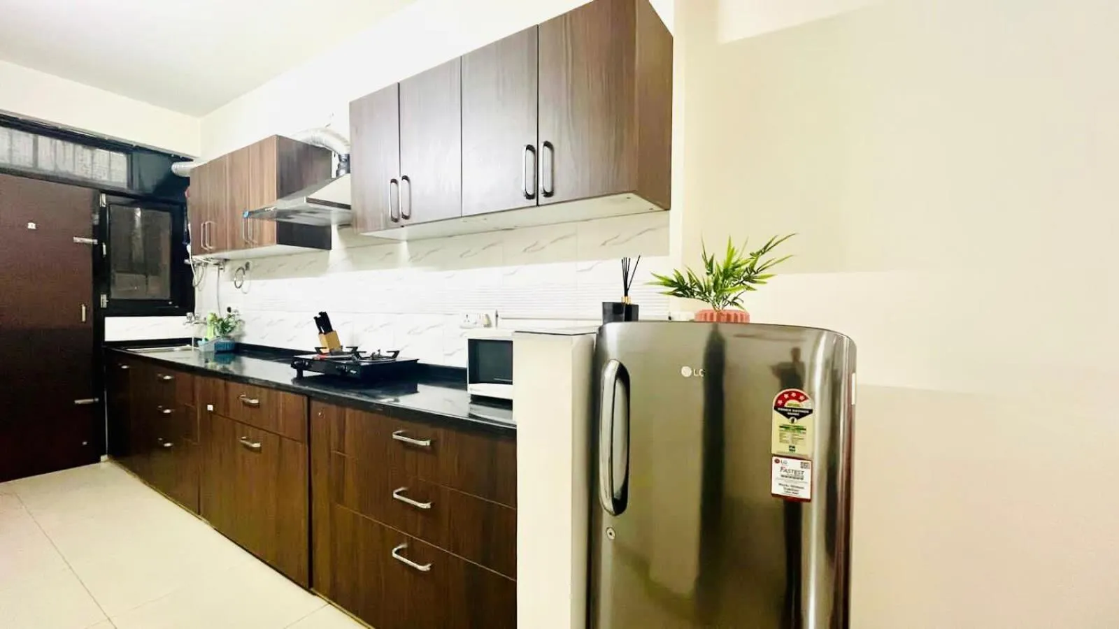 Kitchen or kitchenette in Olive Service Apartments Jaipur - Vaishali Nagar