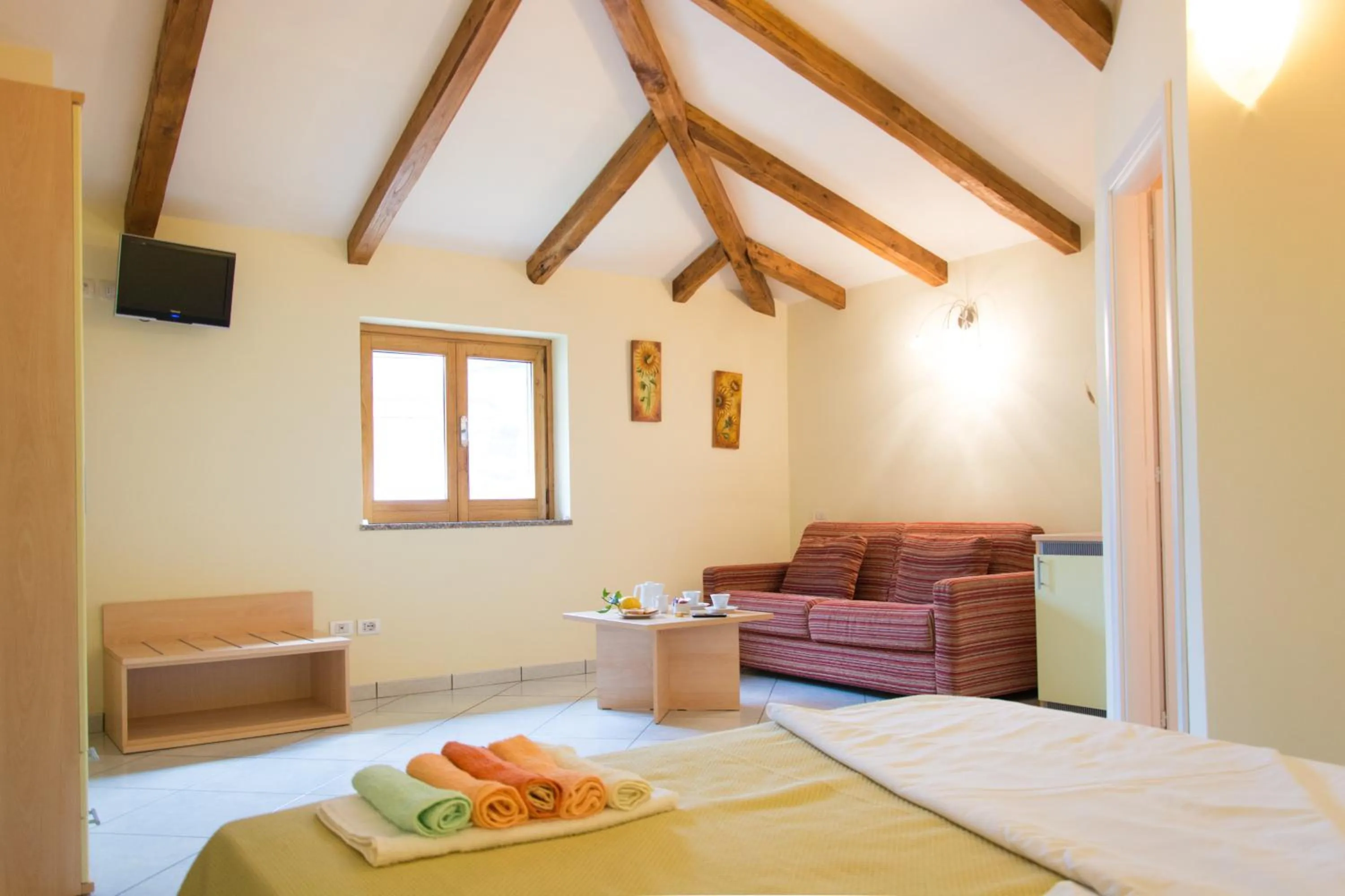 Living room, Bed in Minihotel IRIS